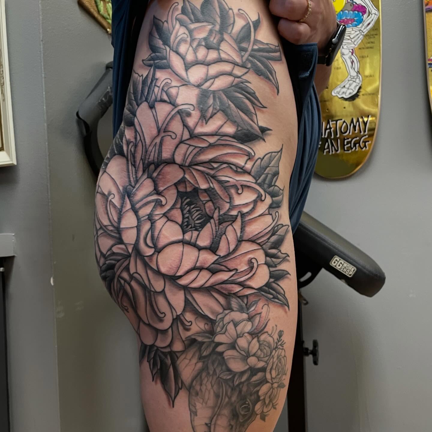 Floral bouquet realism tattoo on the thigh by Mike Lachowicz