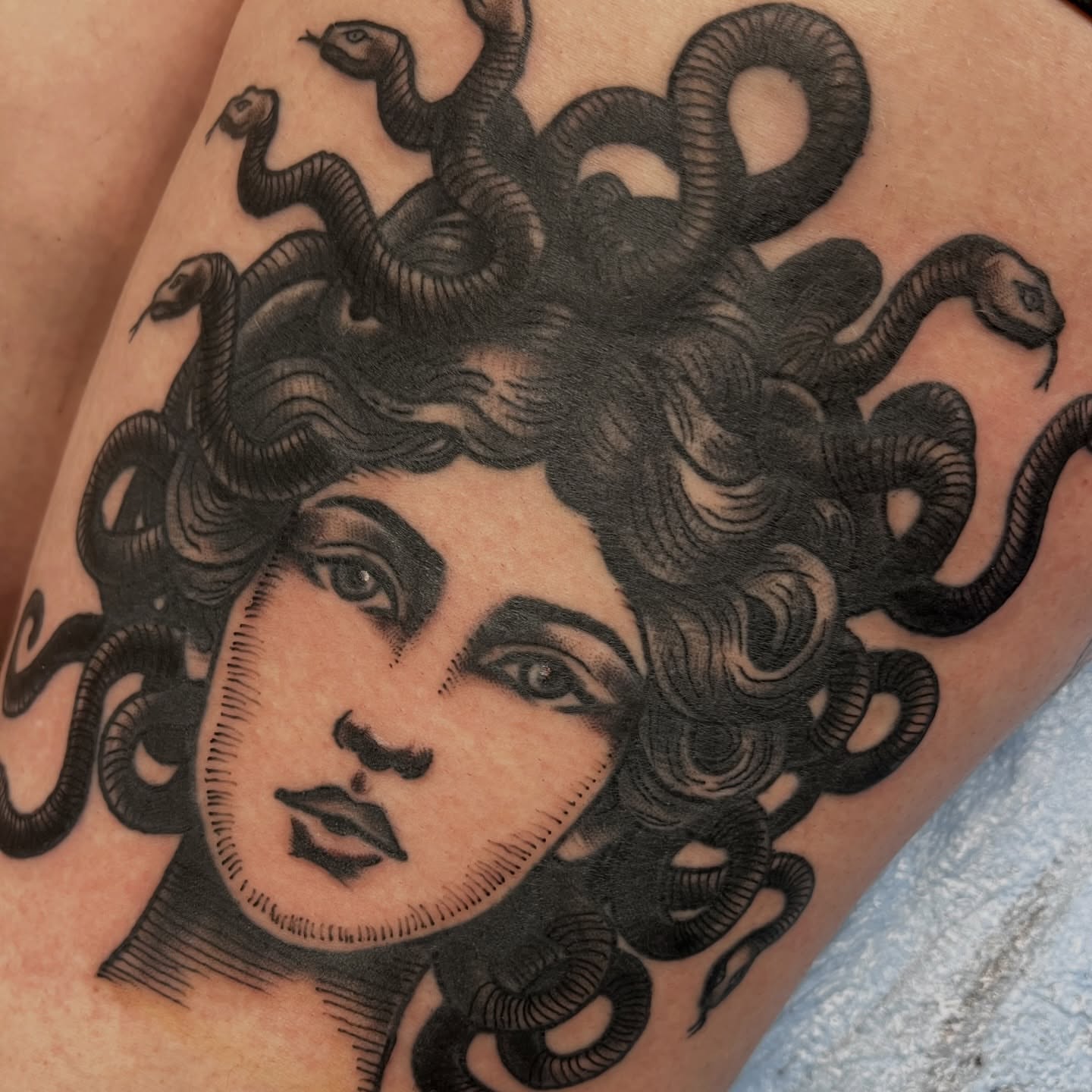Medusa realism tattoo on the thigh by You’ll save me in your phone as Tattoo Tim