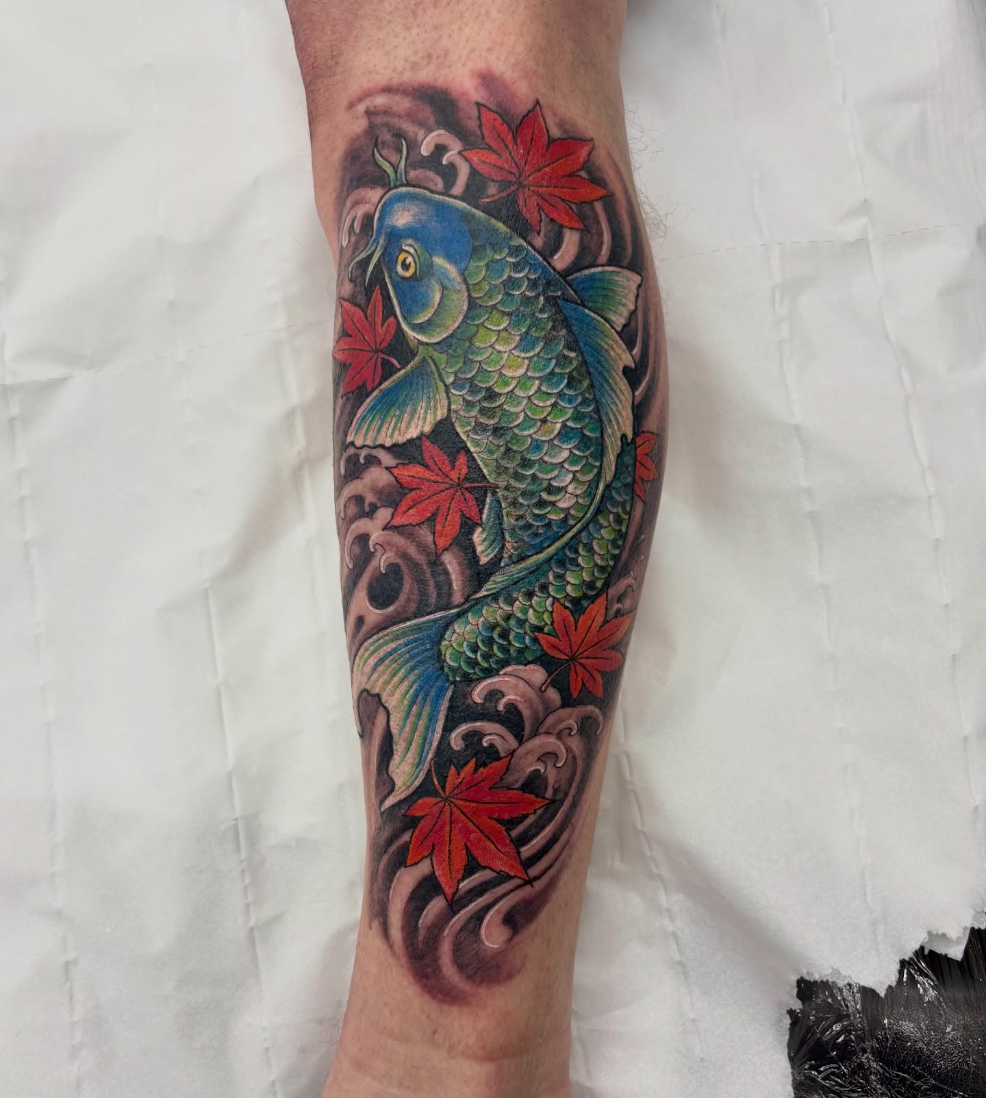 Koi fish and maple leaves japanese irezumi tattoo on the forearm by Ruth Ormsby-Ashworth