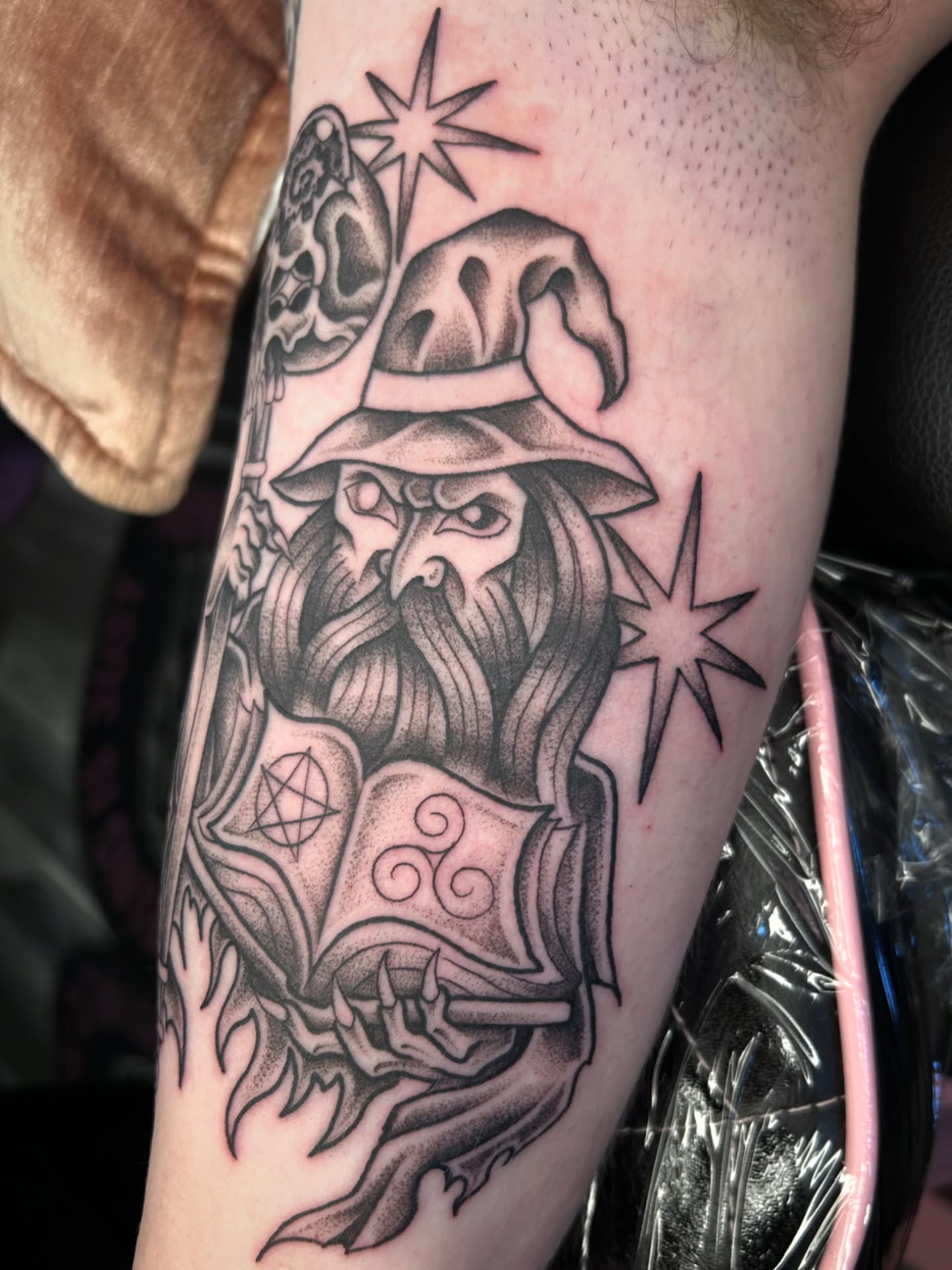 Wizard black and grey tattoo on the forearm by Audrey Migitsch