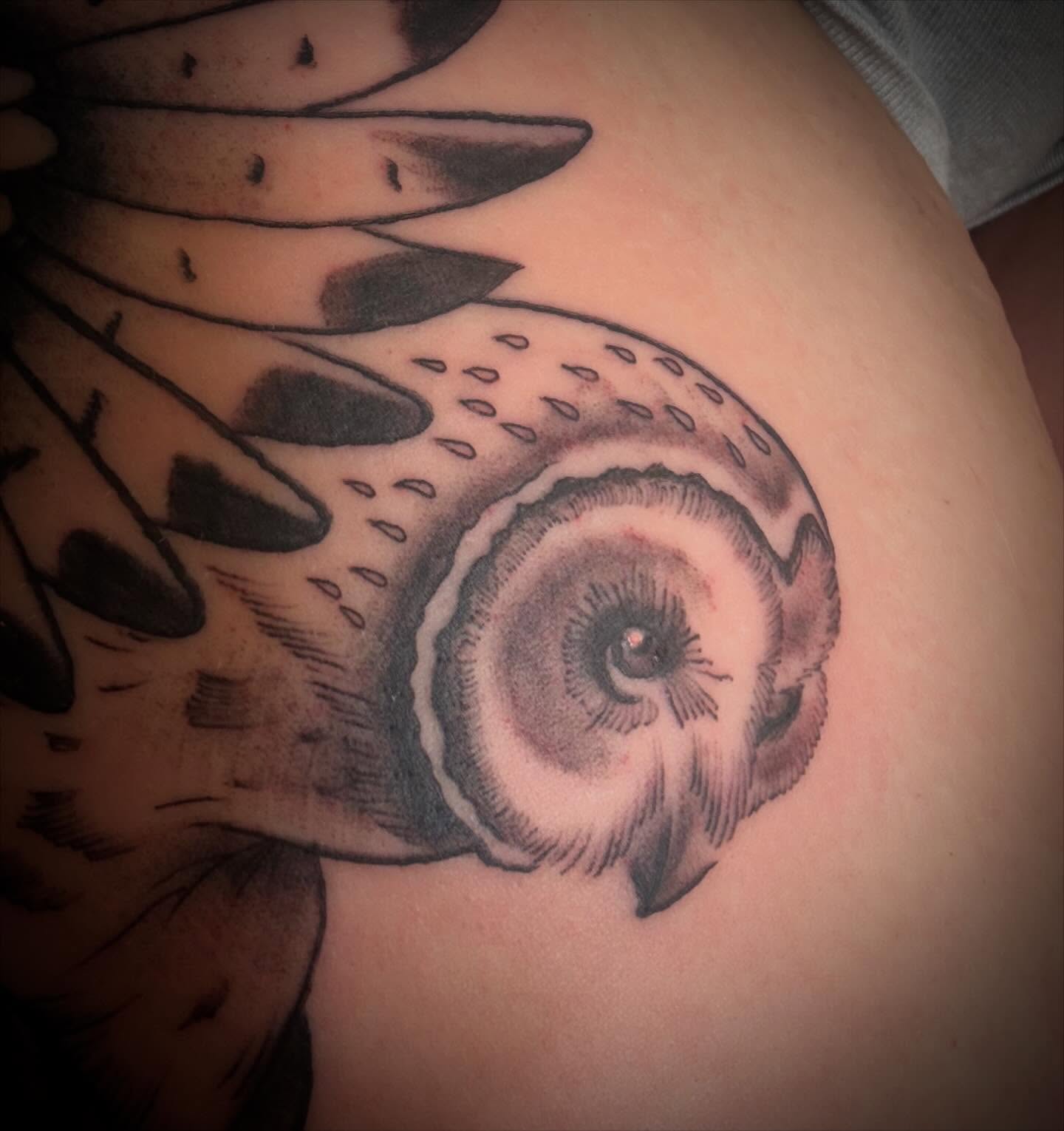 Snail shell black and grey tattoo on the shoulder by ArJay Smith
