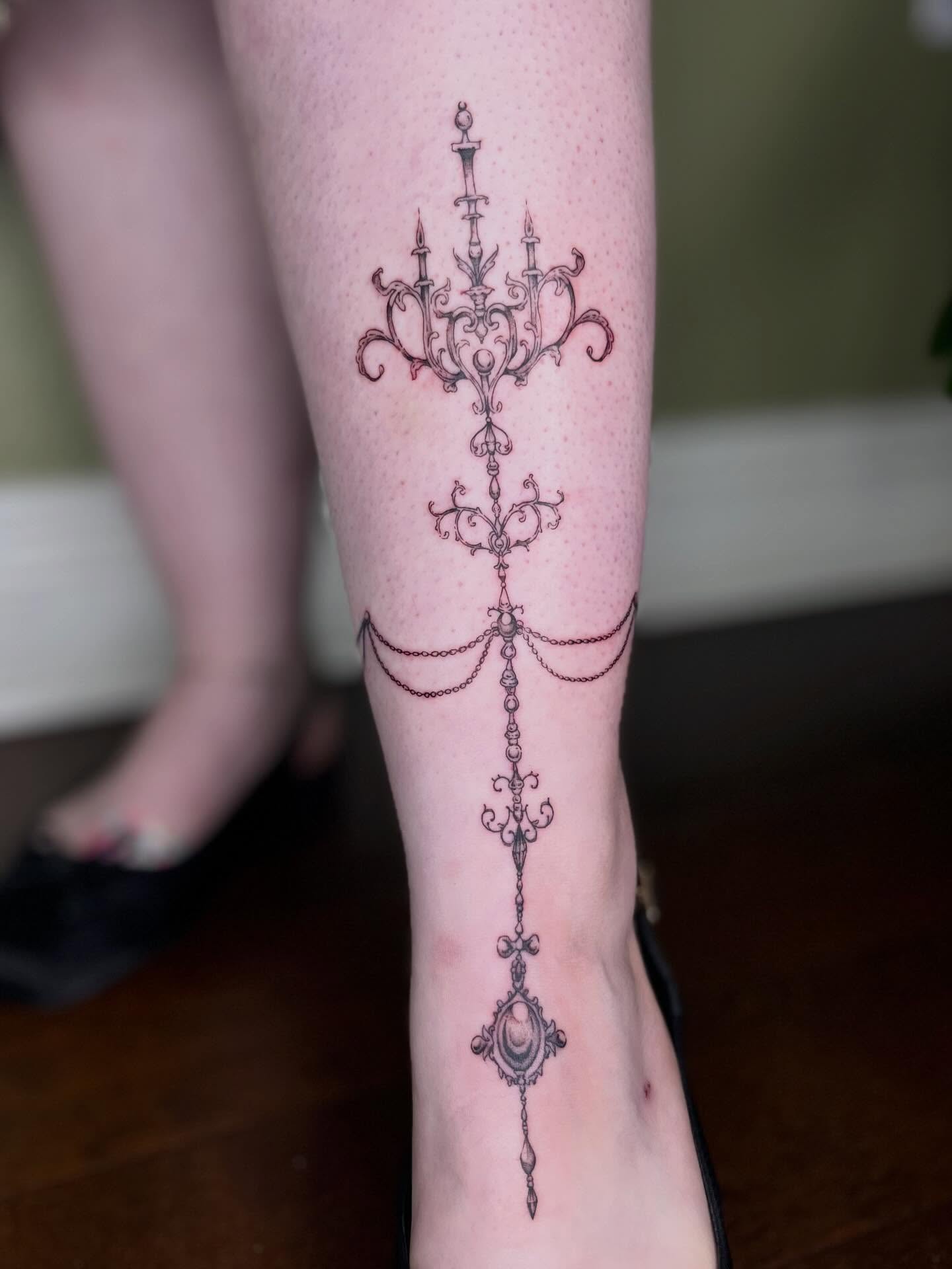 Chandelier ornamental tattoo on the calf by Ash F