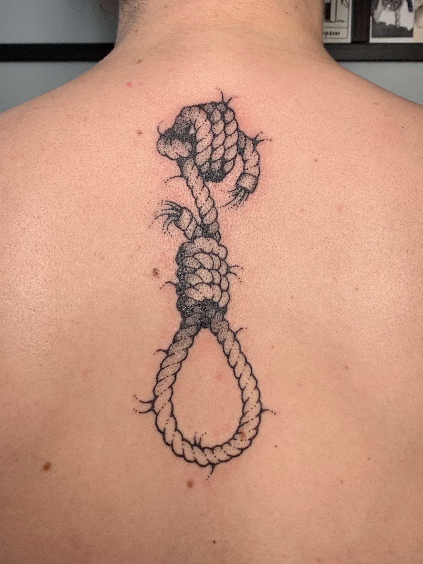 Hangman's noose dotwork tattoo on the back by Lex Lloyd