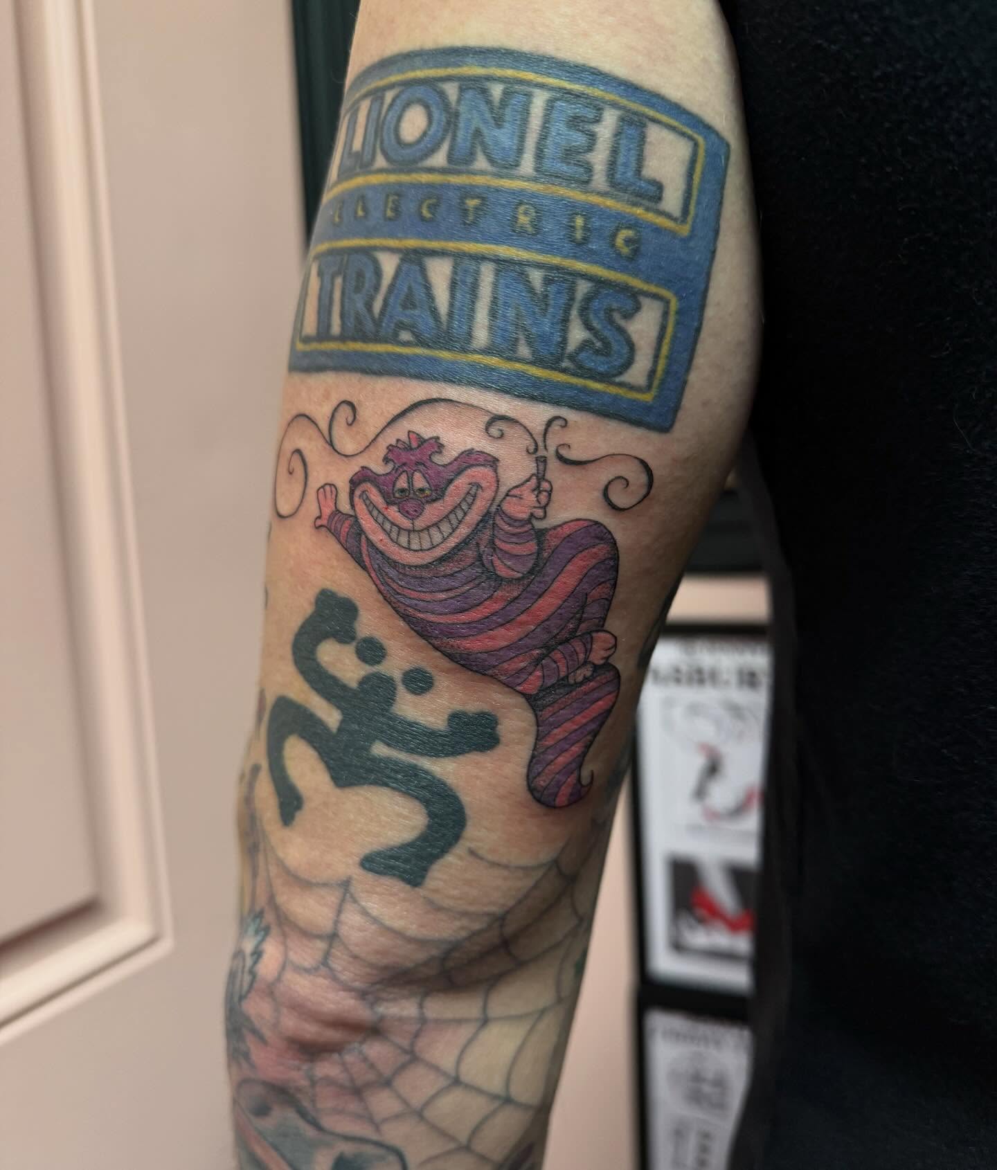 Cheshire cat American traditional tattoo on the forearm by Jennylee Aerts, Asbury Park, New Jersey