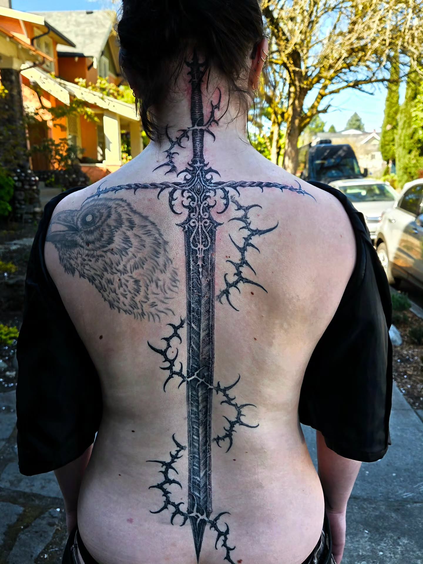 Sword and owl geometric tattoo on the back by @hellscribe