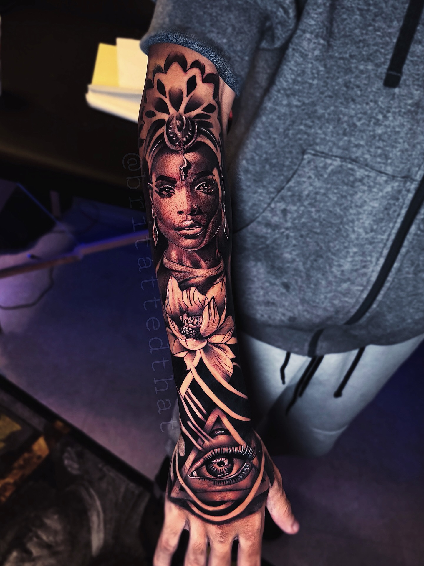 Woman's face realism tattoo on the forearm by Bri Tatted That