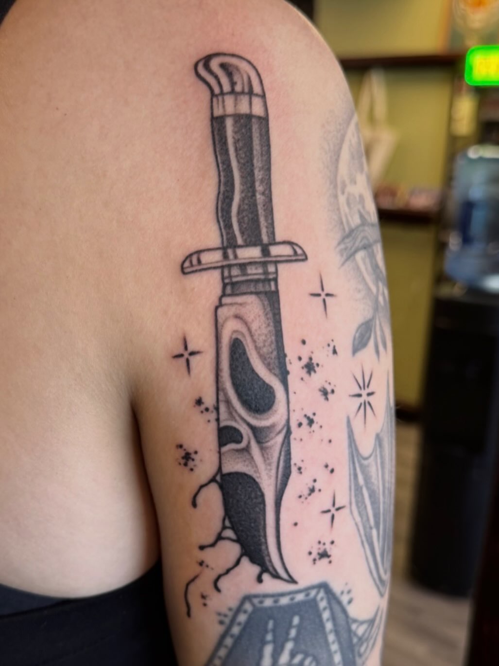 Knife black and grey tattoo on the shoulder by Austin Tattoo Artist