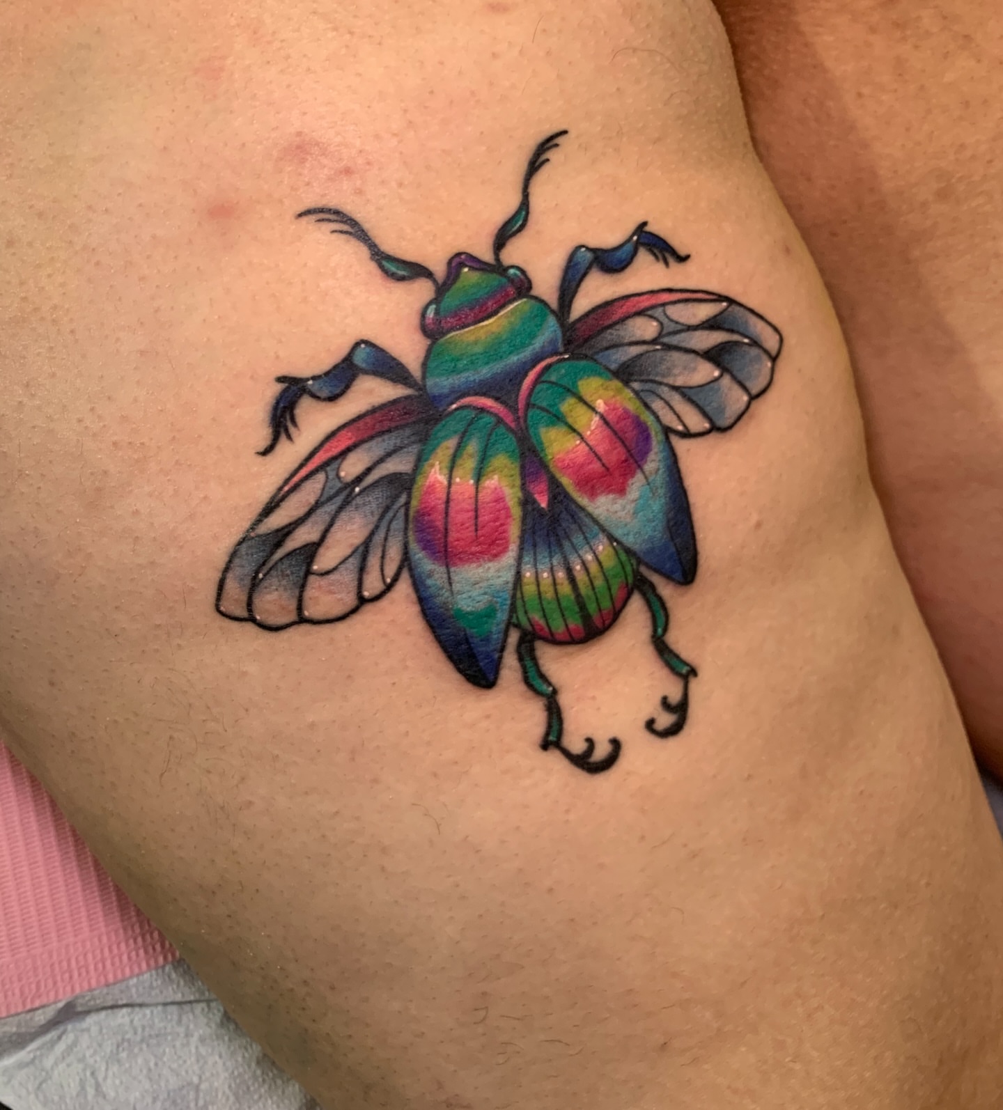 Beetle new school tattoo on the thigh by Aubrianna Grisez