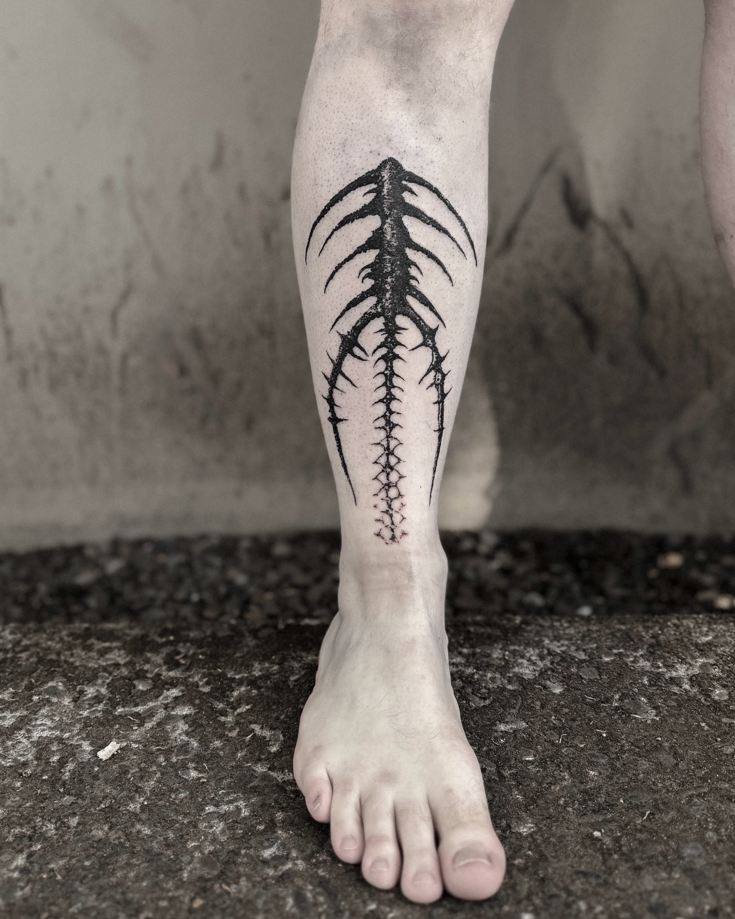 Spine black and grey tattoo on the calf by ąʑཞąıą ཞąıŋ