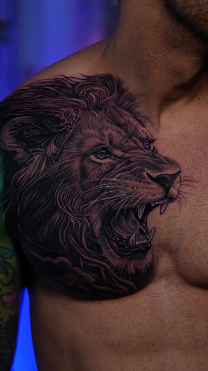 Lion's head realism tattoo by Adrian Gonzalez