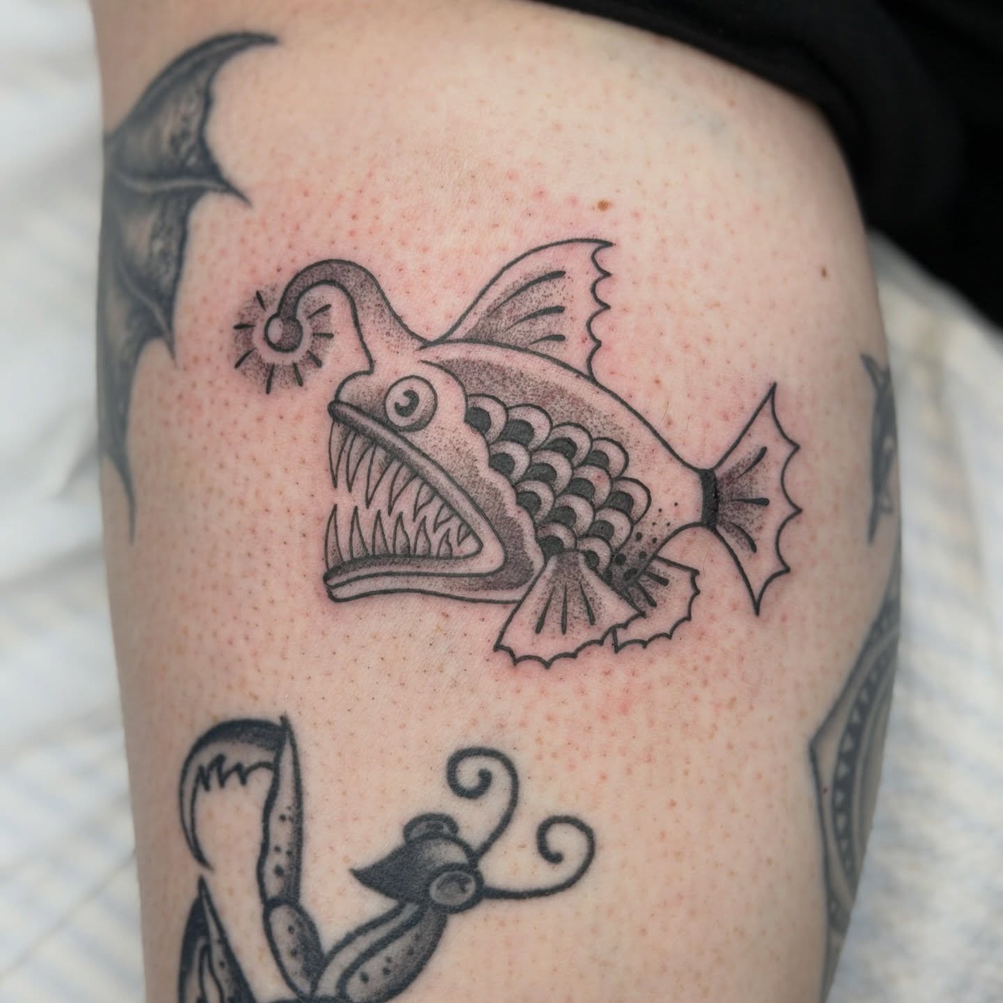 Angler fish dotwork tattoo on the thigh by Kailey Ru, Knoxville, Tennessee
