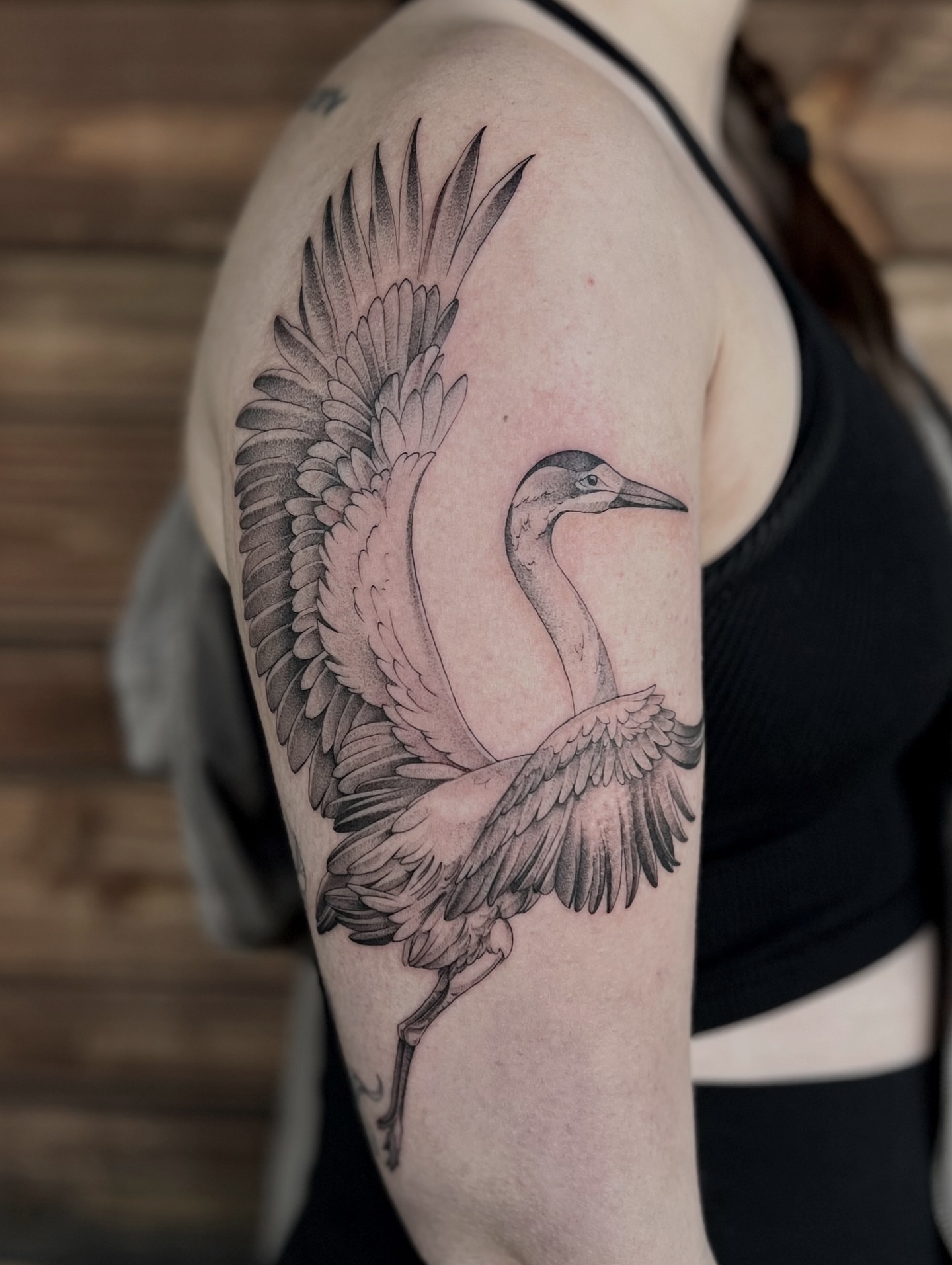 Heron black and grey tattoo on the shoulder by Tehnaya