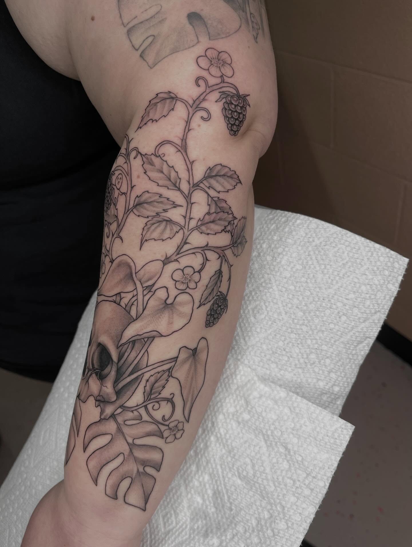 Botanical realism tattoo on the forearm by Allison Gallagher