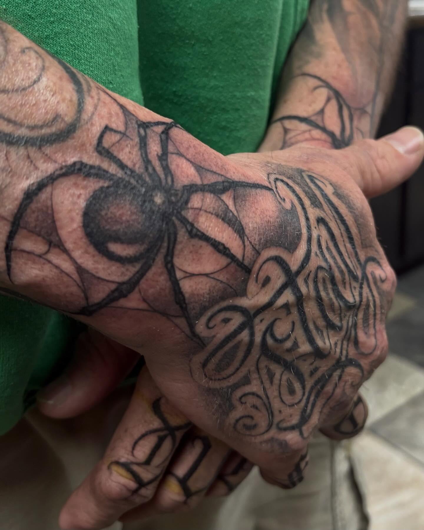 Spider web black and grey tattoo on the hand by Trusty Dizon Tattoo Artist