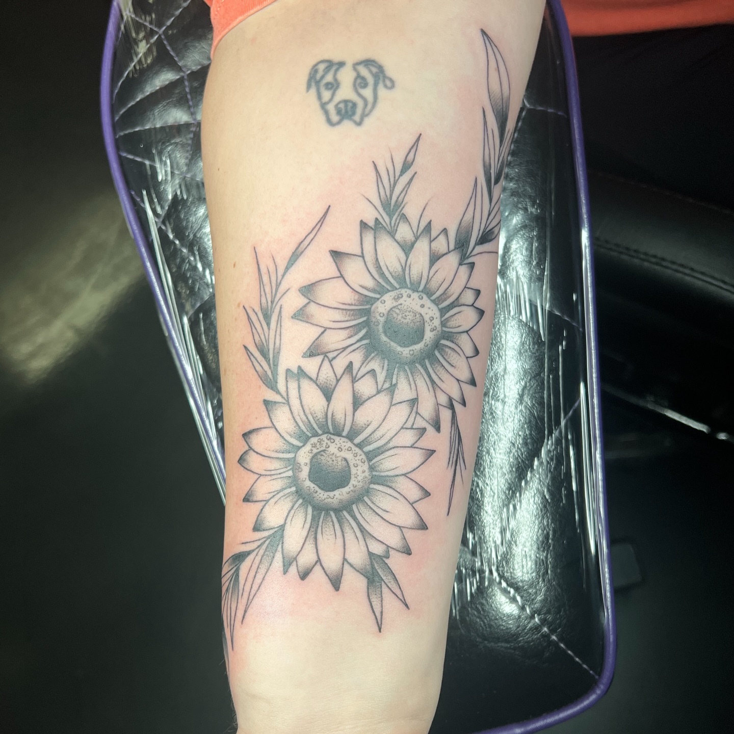 Sunflowers black and grey tattoo on the forearm by Brian Mock