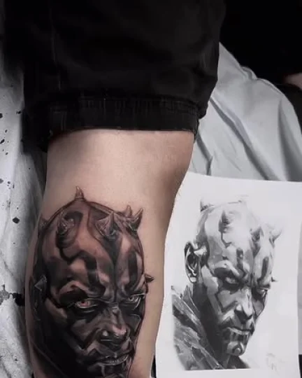 Demon face dark realism tattoo on the forearm by Magdalena Davis