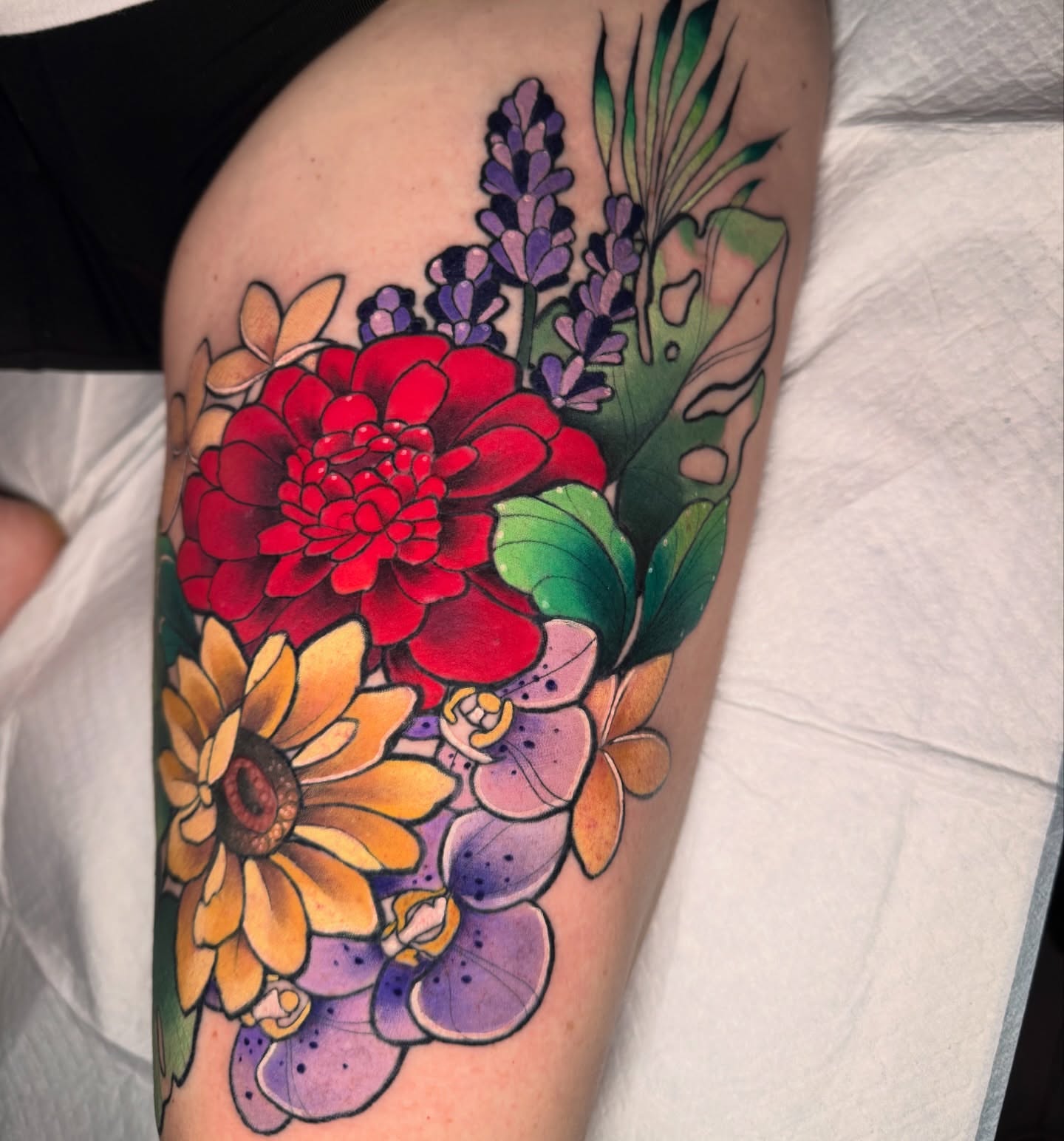 Floral bouquet new school tattoo on the thigh by Caitlyn