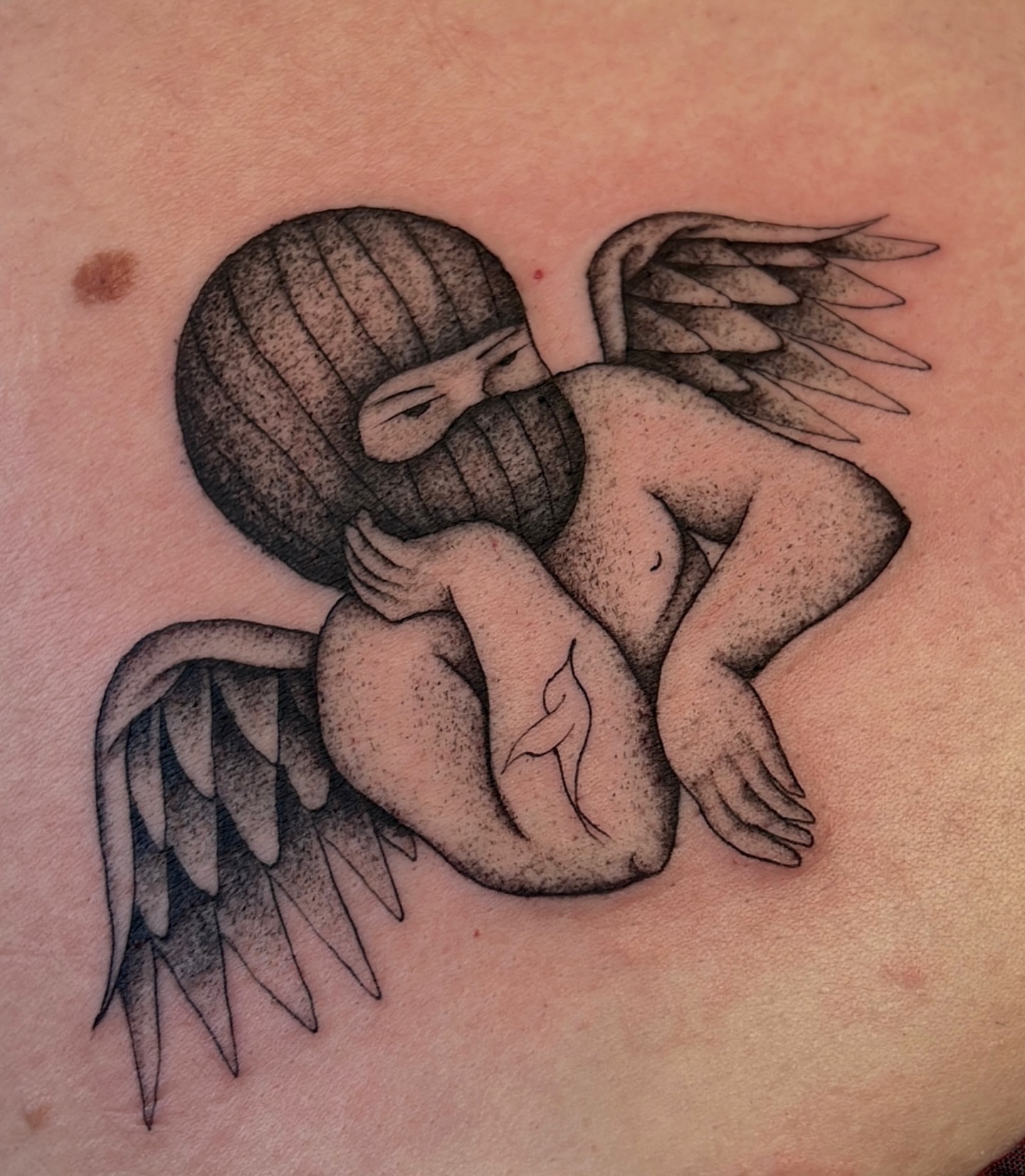 Angel with mask dotwork tattoo on the torso by David Delacruz