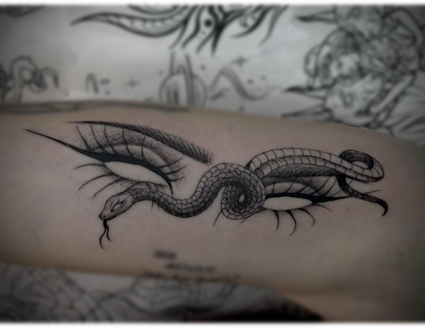 Snake dotwork tattoo on the forearm by Weho Tattoo Artist Lupe