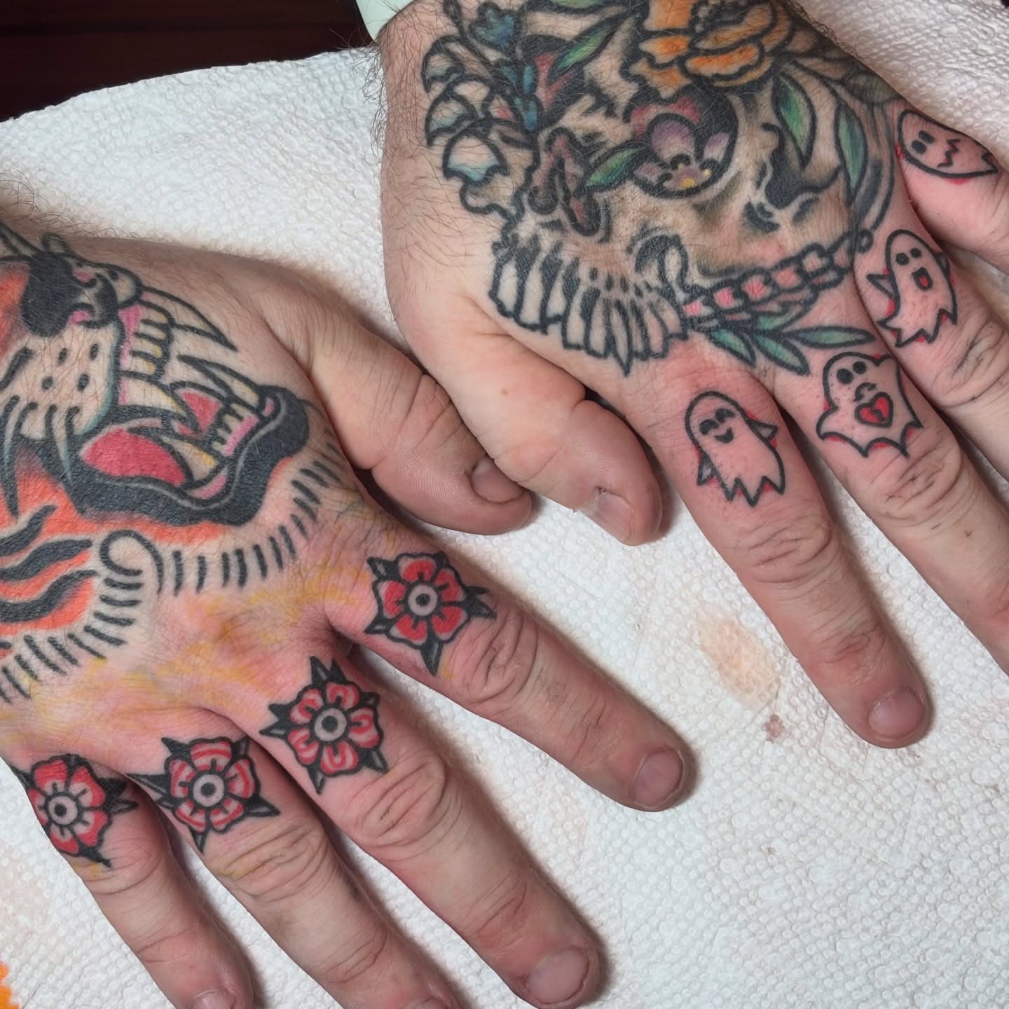 Skull and ghost American traditional tattoo on the hand by Malachi