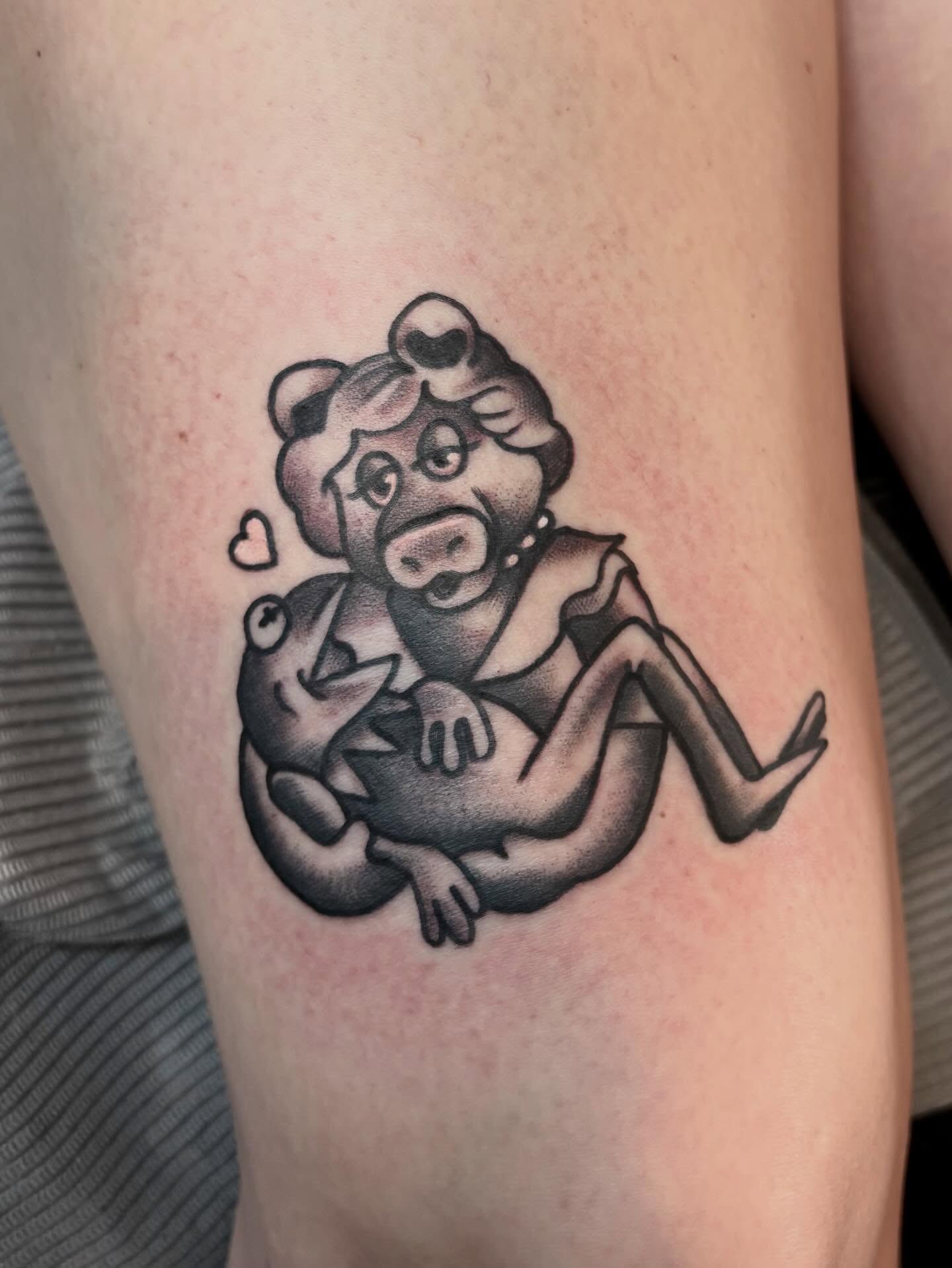 Pig hugging baby pig black and grey tattoo on the thigh by Mim
