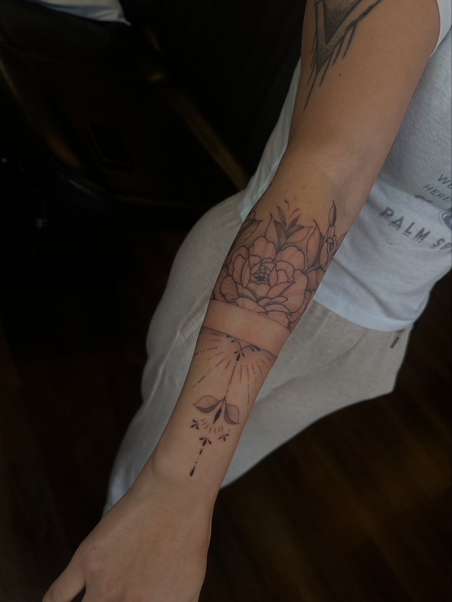 Floral design black and grey tattoo on the forearm by Priscilla Michels