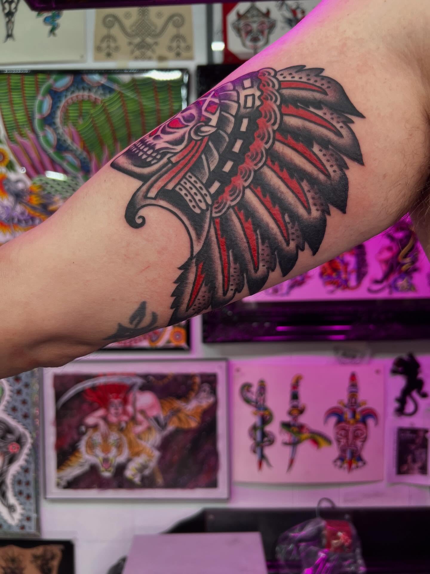 Native headdress American traditional tattoo on the forearm by Charlie Campanella