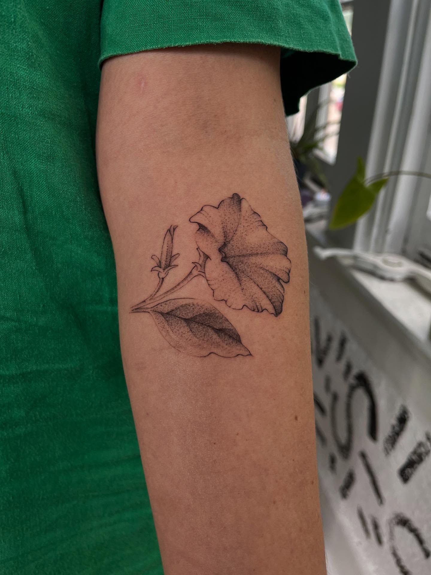 Flower dotwork tattoo on the forearm by Victoria Irula