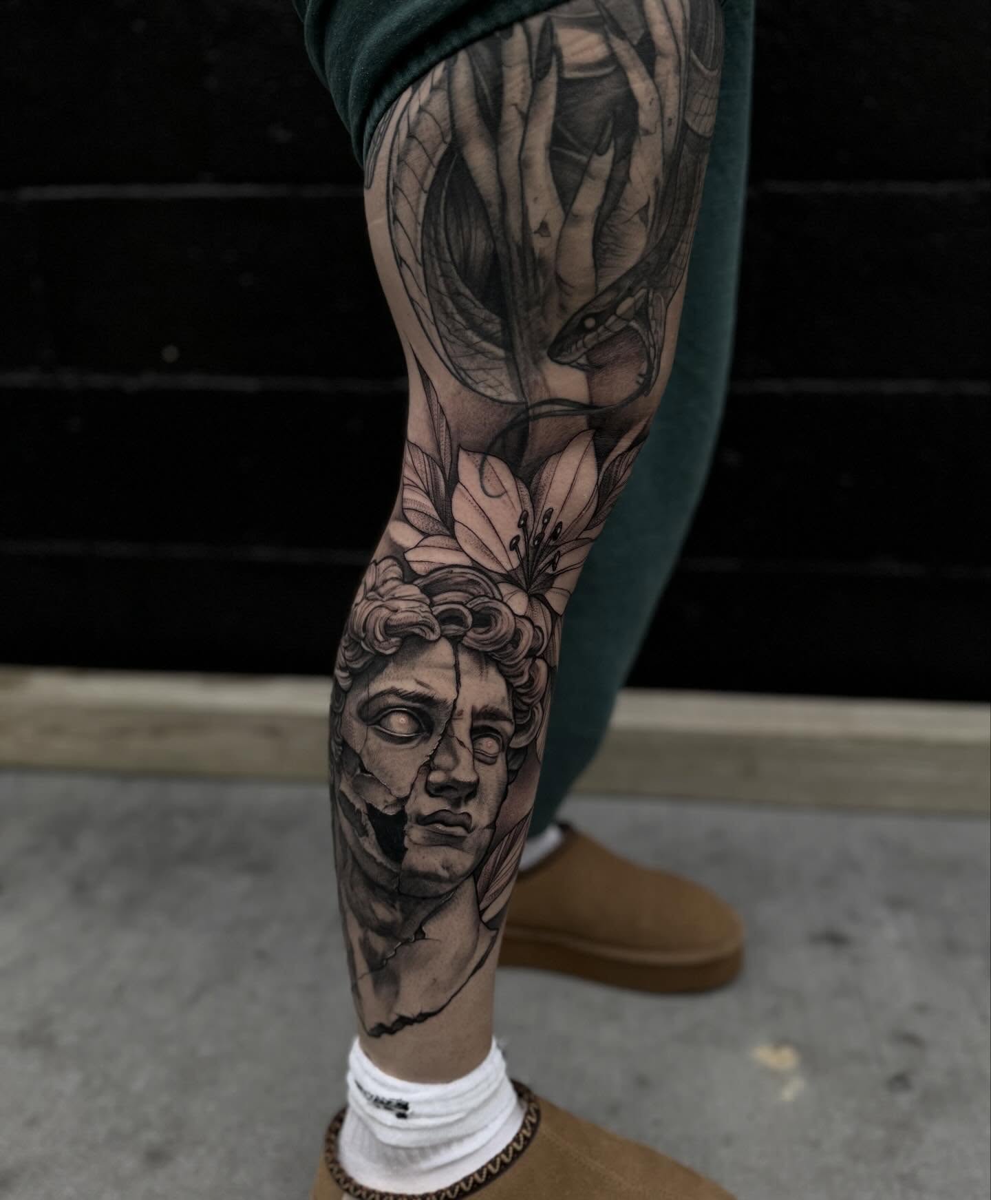 Statue head realism tattoo on the forearm by Keith Smith