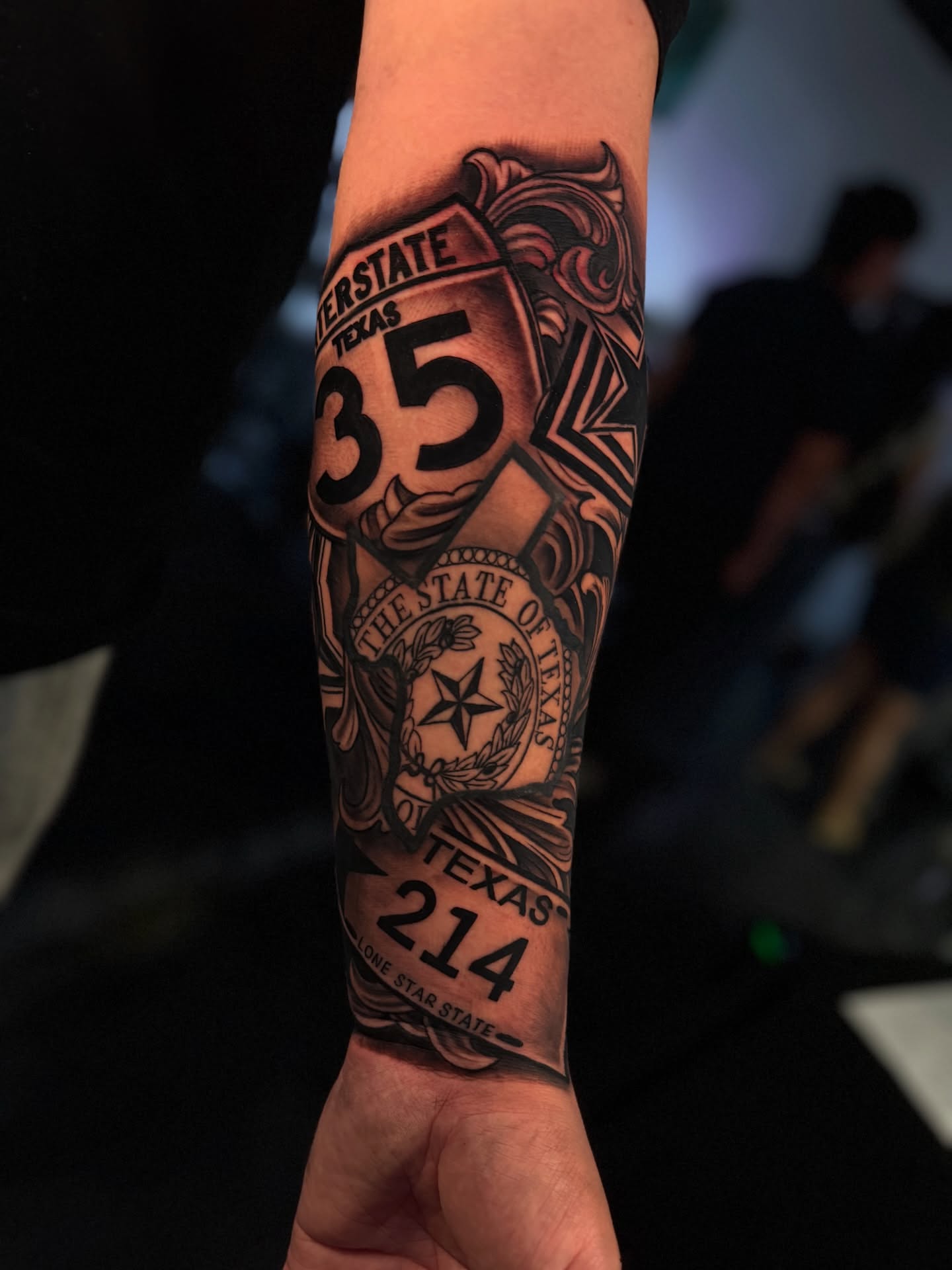 Interstate highway sign American traditional tattoo on the forearm by Dreamchaserink