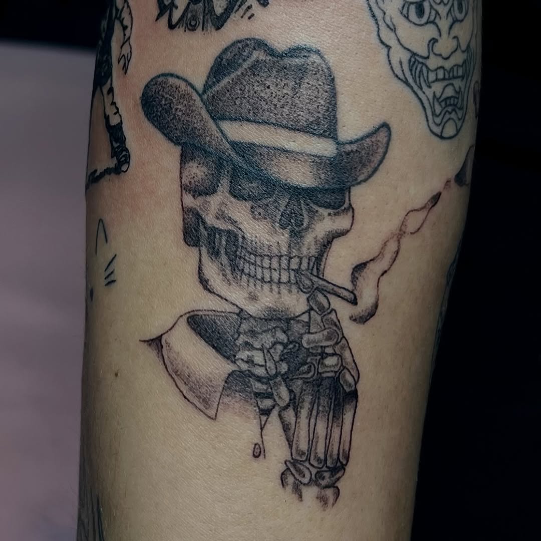 Skeleton smoking a cigarette realism tattoo on the forearm by Dani Sandoval, Anaheim, California