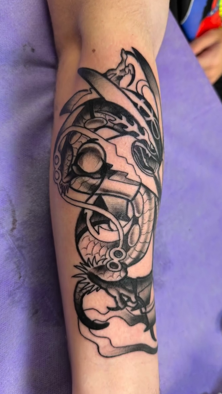Dragon and koi fish tattoo Japanese tattoo on the forearm by Kimberly Parton- Chapel Hill Tattooer, Chapel Hill, North Carolina