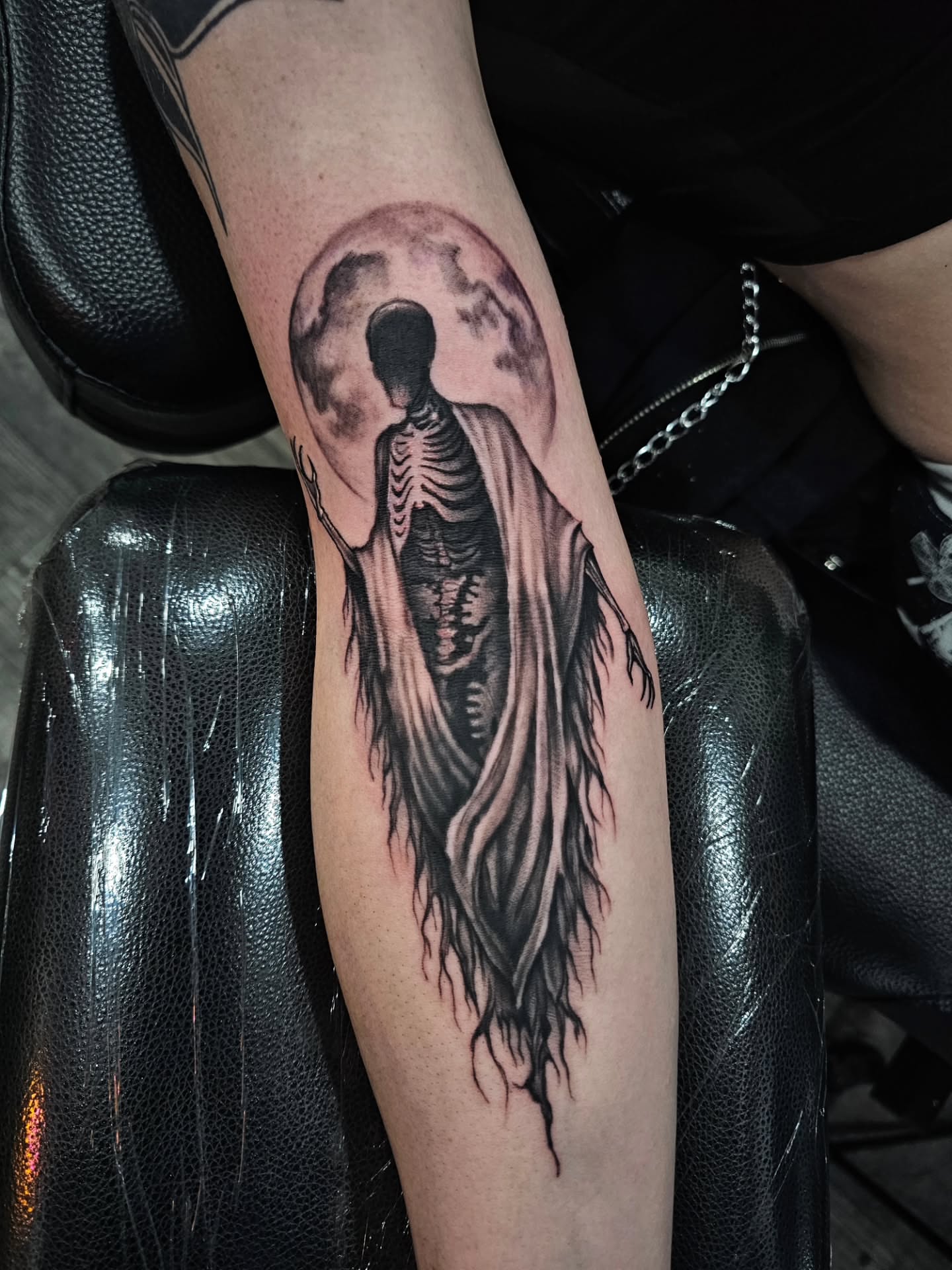 Skeleton figure dark realism tattoo on the forearm by Matthew Ashmore