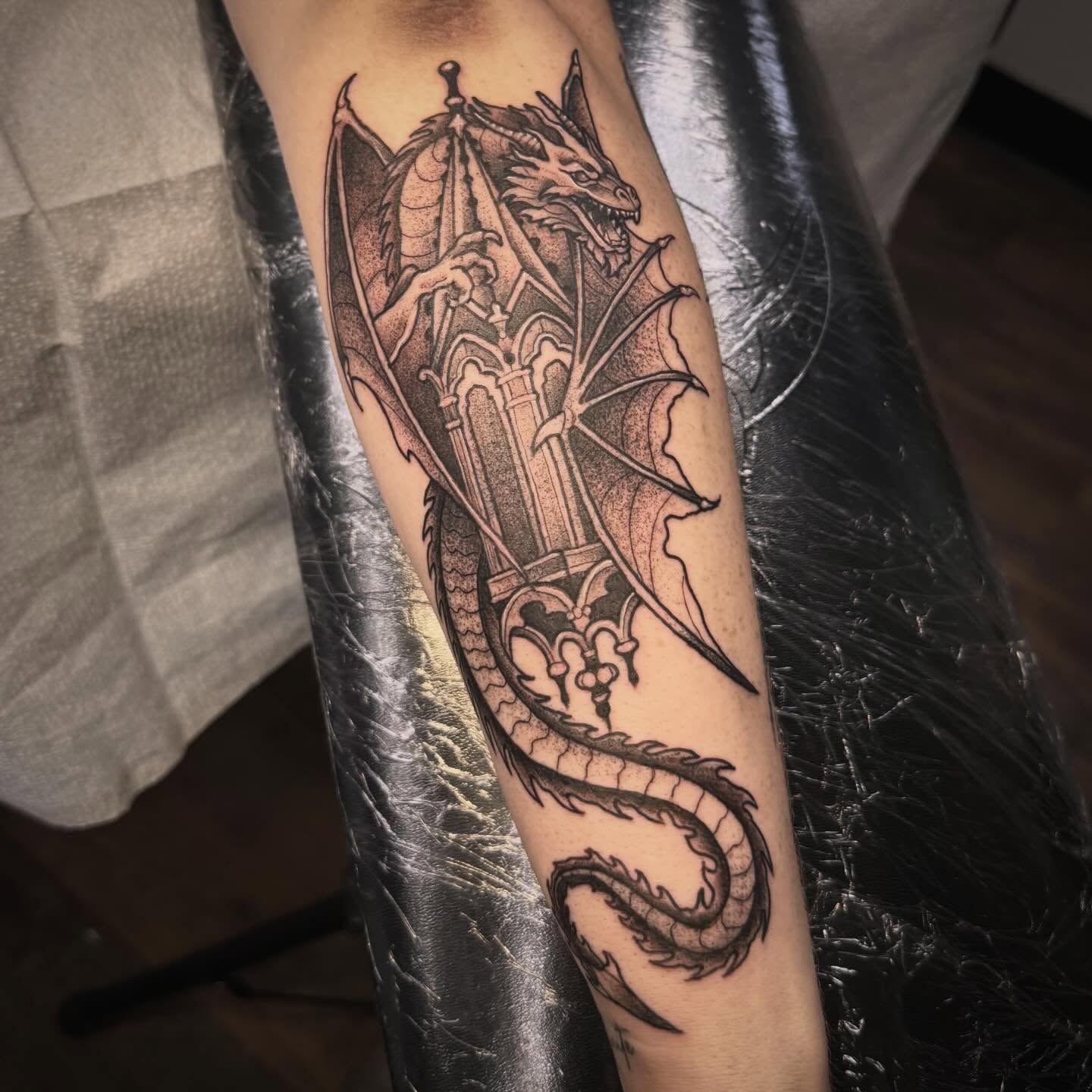 Dragon realism tattoo on the forearm by Sarah Foltz