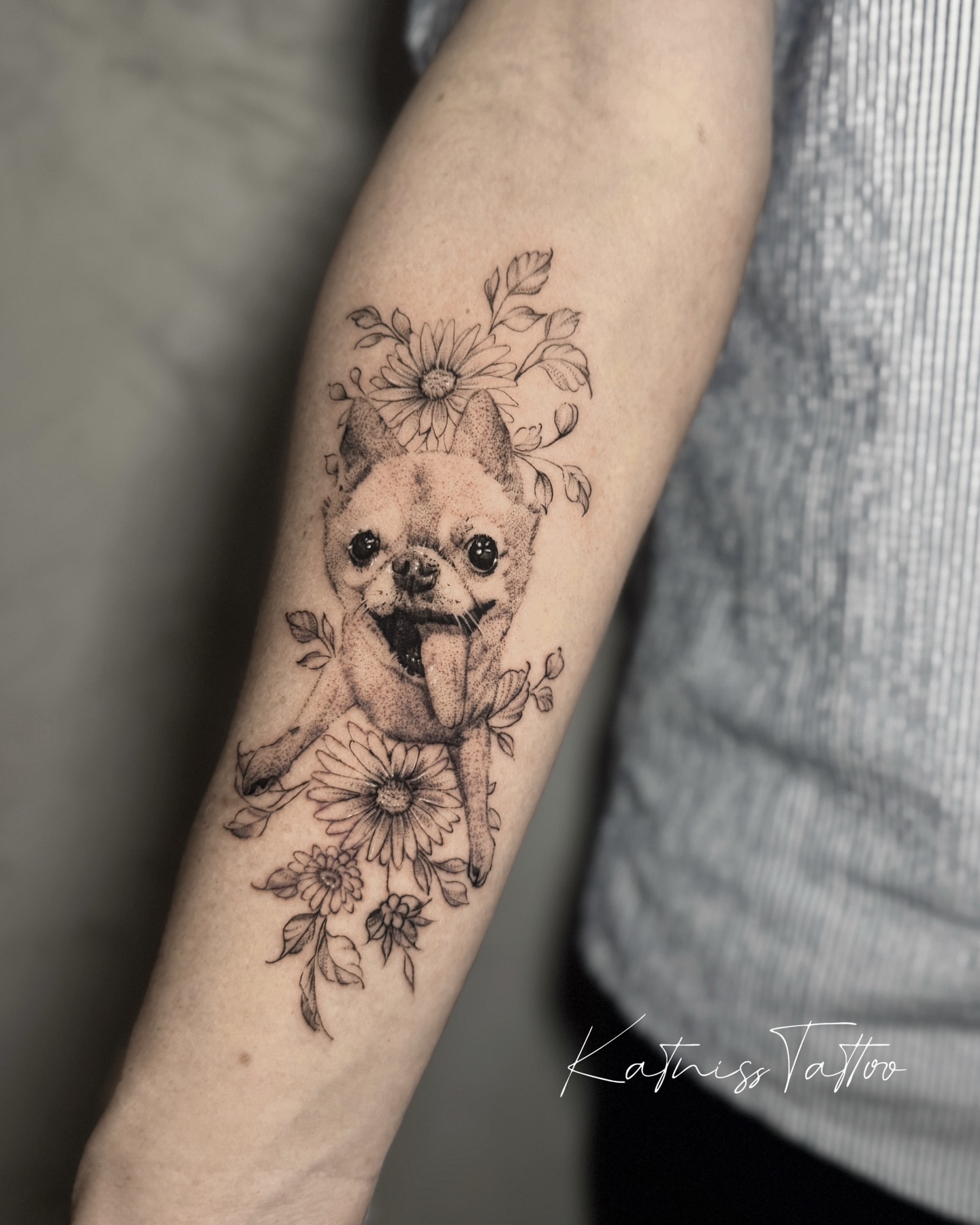 Chihuahua with flowers realism tattoo on the forearm by 𝙆𝙖𝙩𝙣𝙞𝙨𝙨