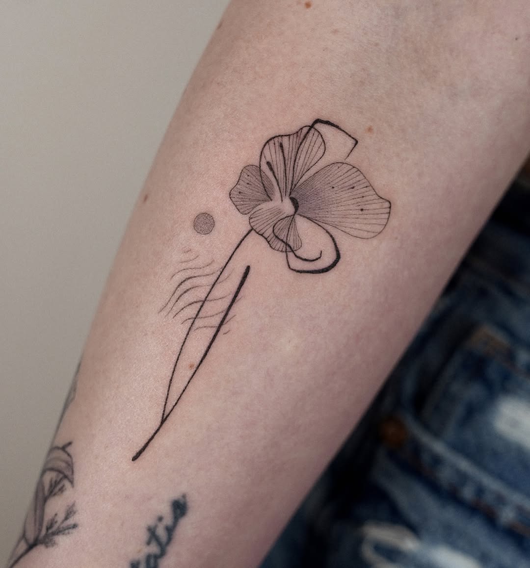 Abstract flower fine line tattoo on the forearm by Helly March