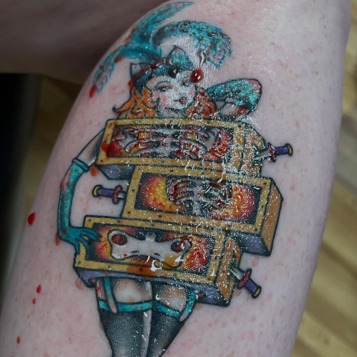 Jester with harp American traditional tattoo on the forearm by Mike Lachowicz