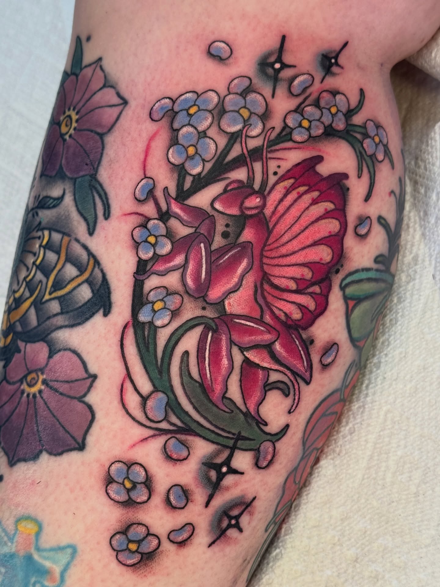 Butterfly and flowers American traditional tattoo on the forearm by Tattoos by Angel Lee
