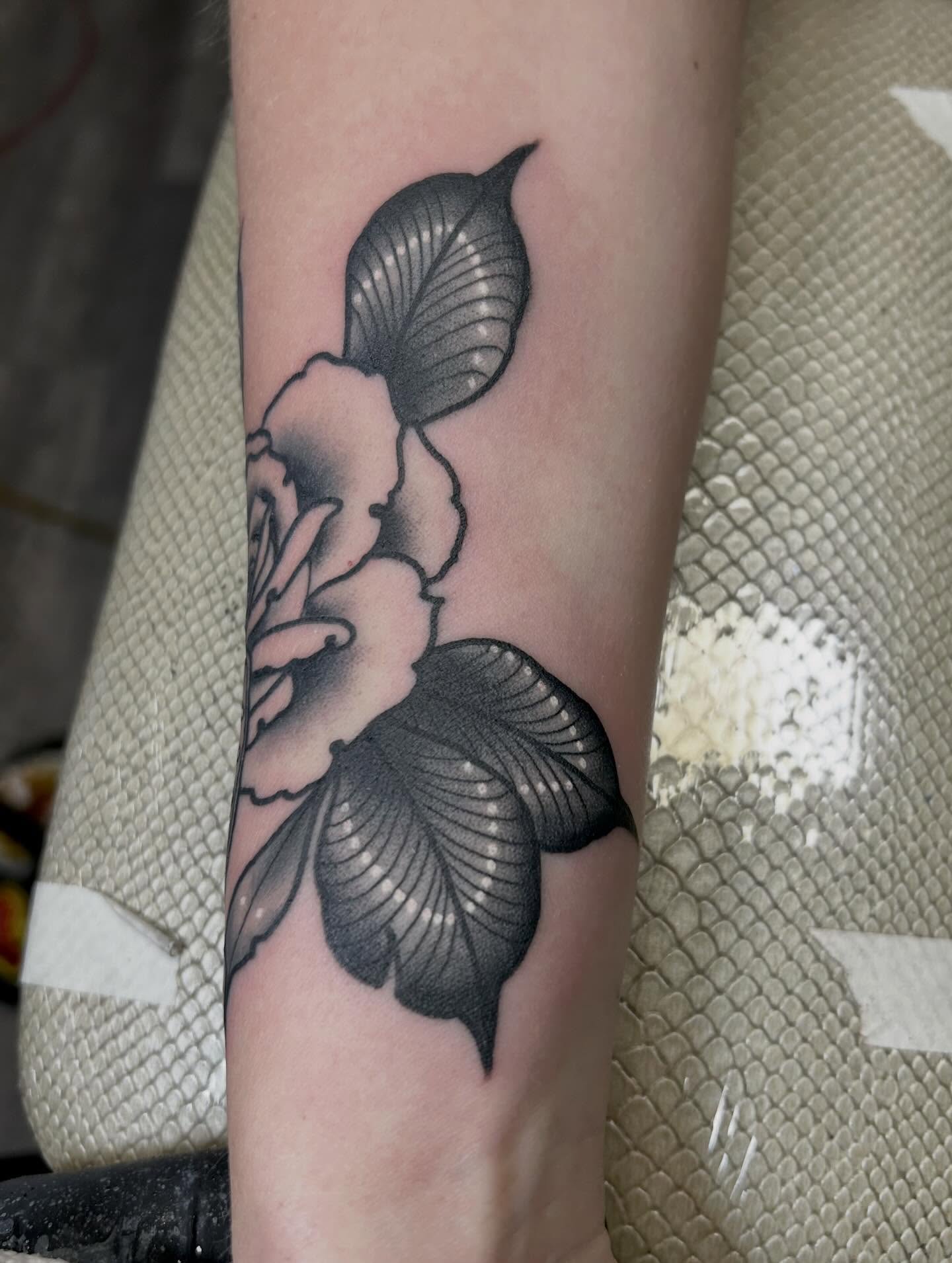 Flower black and grey tattoo on the forearm by darklord_666