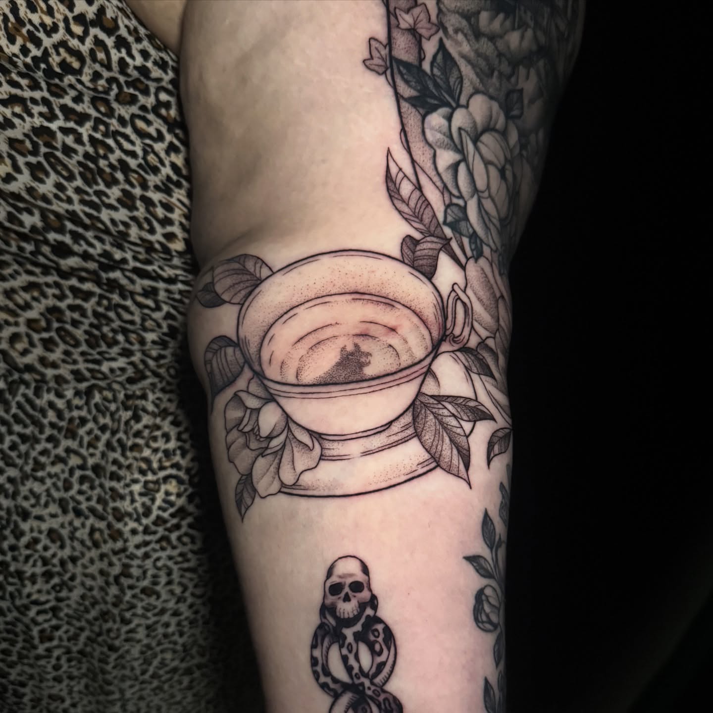 Tea cup and flowers dotwork tattoo on the forearm by Lauren B