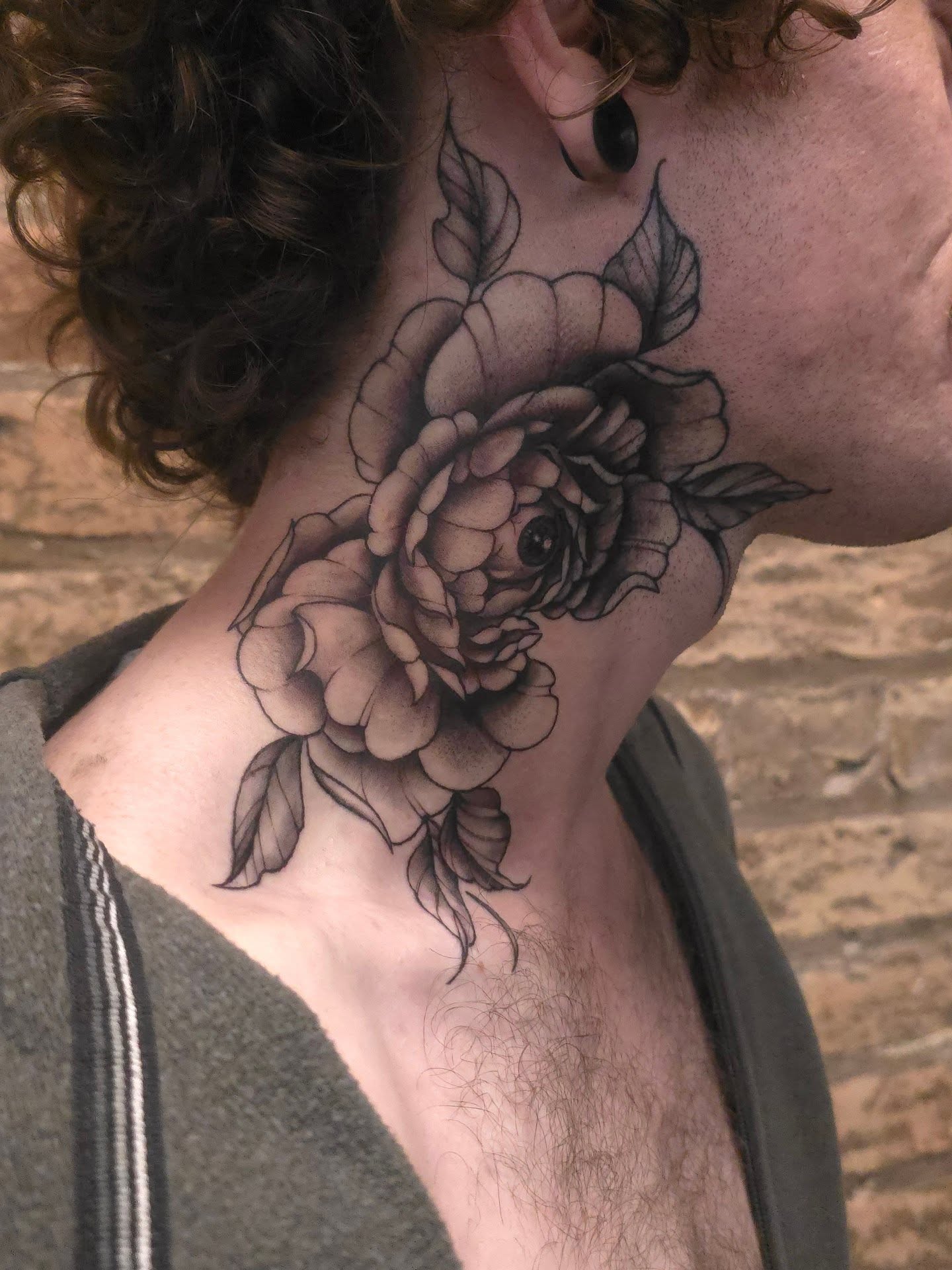 Rose black and grey tattoo on the neck by Trinity