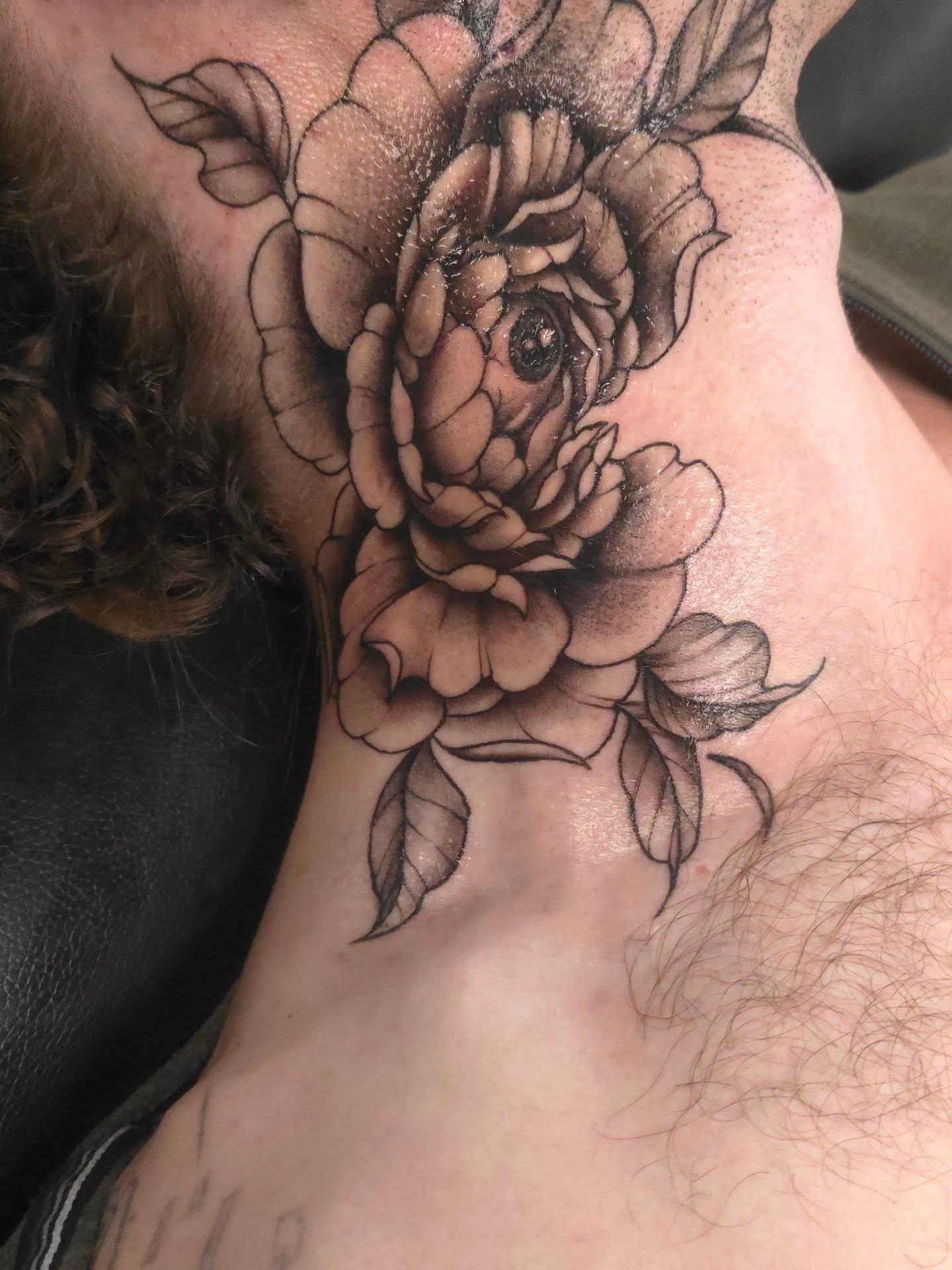 Rose black and grey tattoo on the neck by Trinity