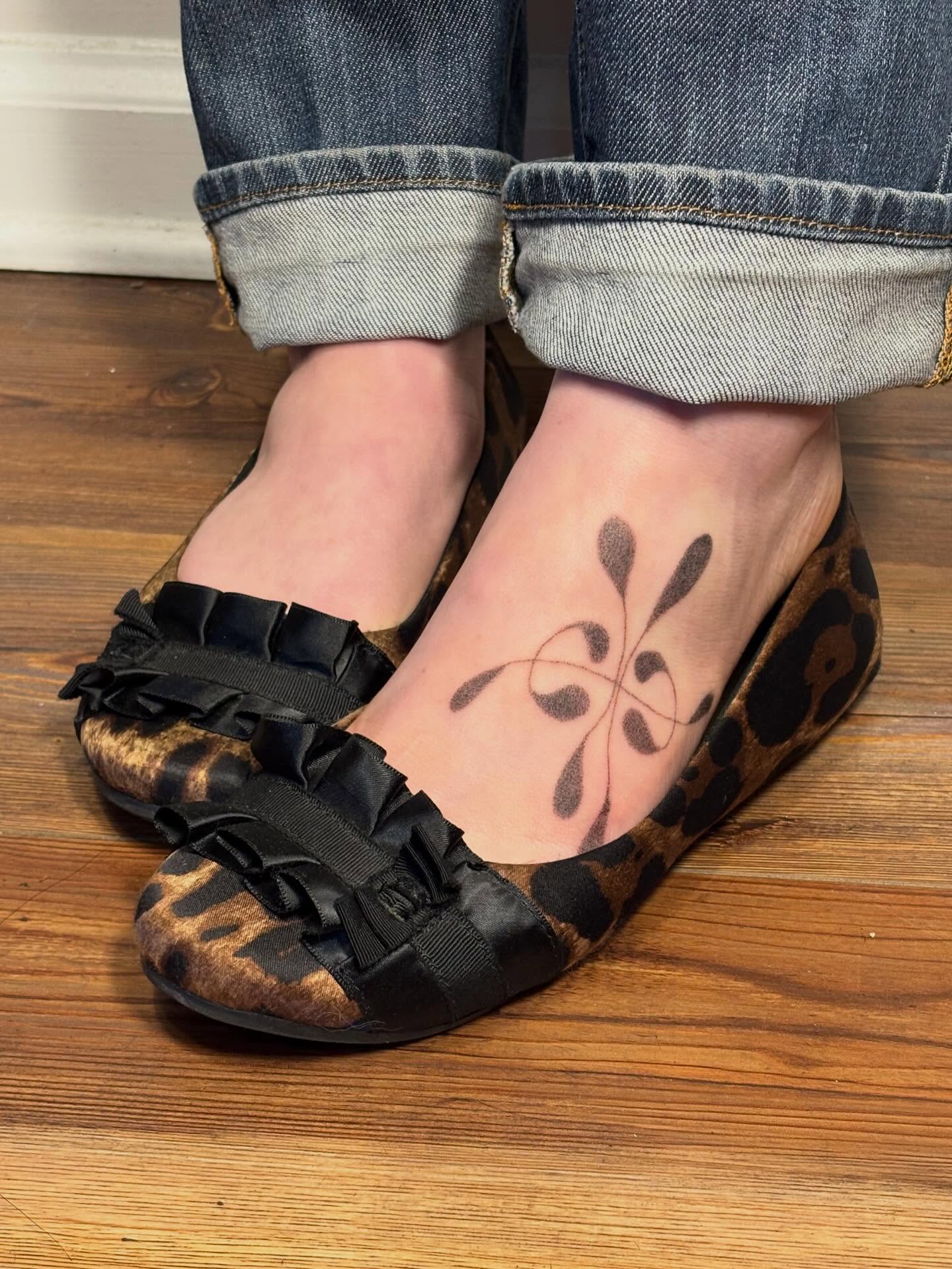 Abstract floral geometric tattoo on the foot by Jill