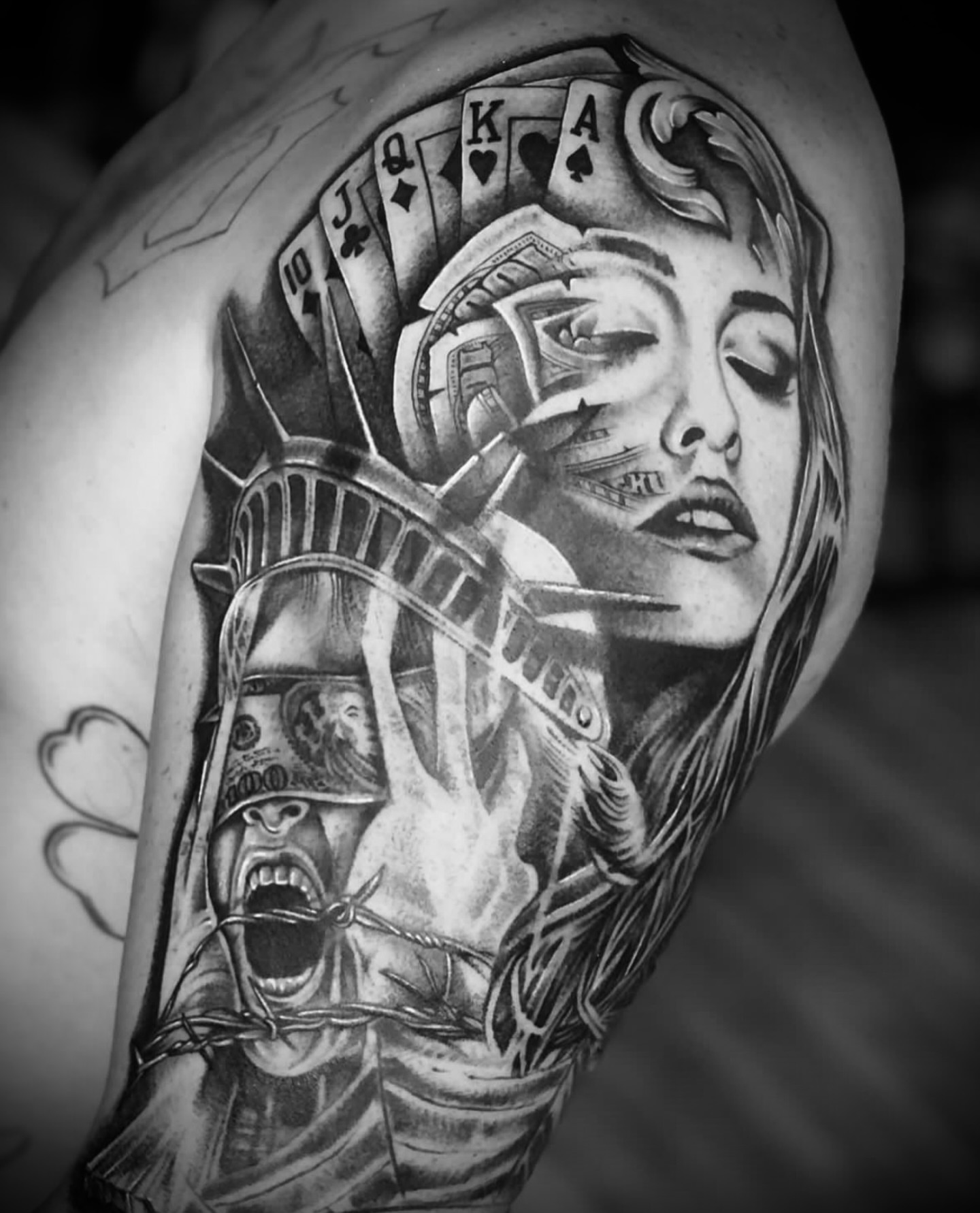 Statue of liberty realism tattoo on the shoulder by Big Steve Lewis