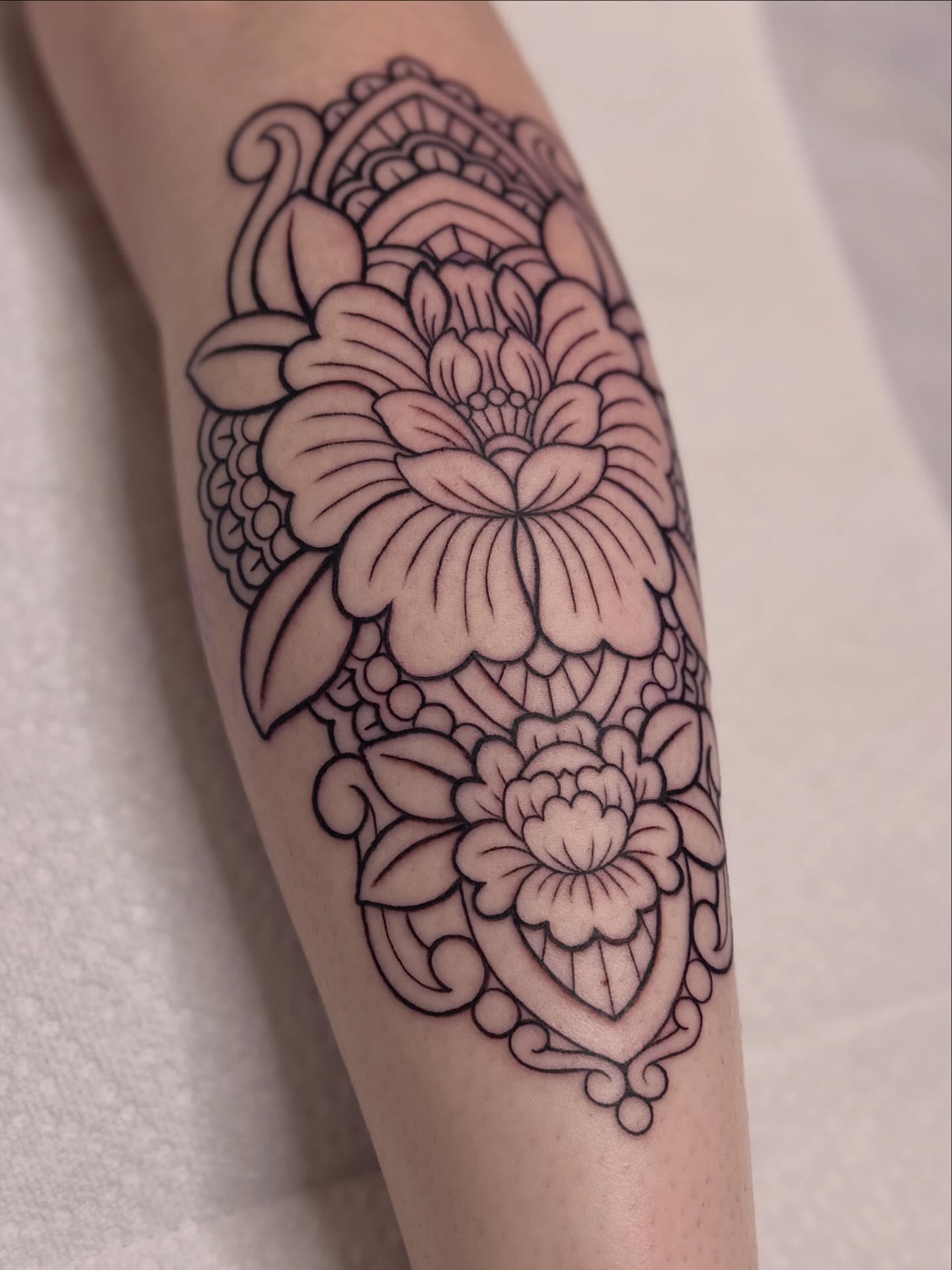 Floral design ornamental tattoo on the forearm by Dani Di Pietrantonio