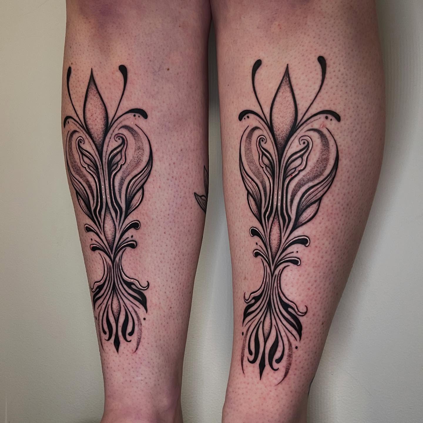 Floral design dotwork tattoo on the calf by Elisa