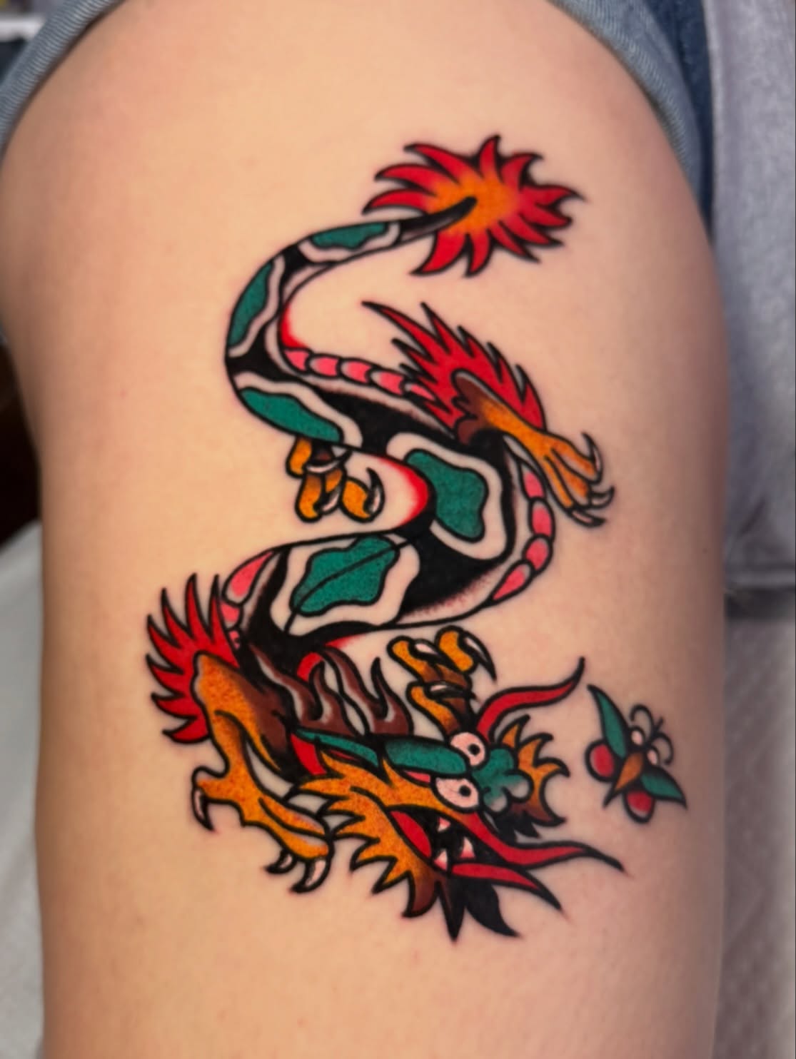 Dragon American traditional tattoo on the thigh by Stevie Lowenstein, Cincinnati, Ohio