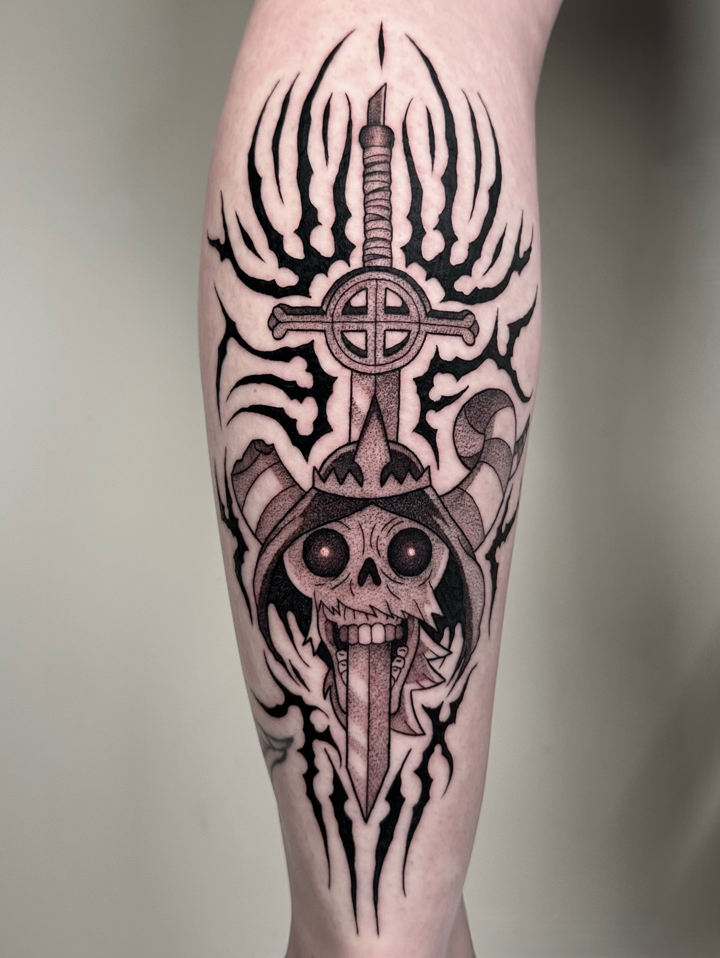 Skull with sword dotwork tattoo on the forearm by Brooklyn Bailey