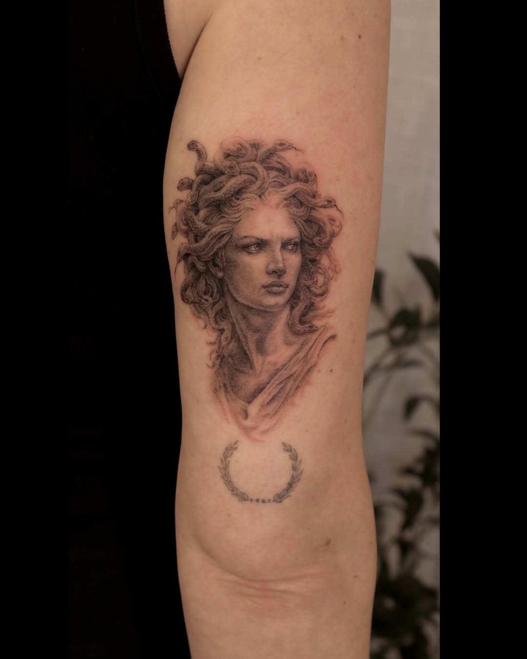 Medusa bust with snakes realism tattoo on the forearm by Nicholas Solomon