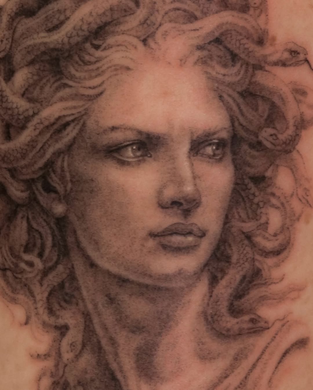 Medusa portrait realism tattoo on the head by Nicholas Solomon
